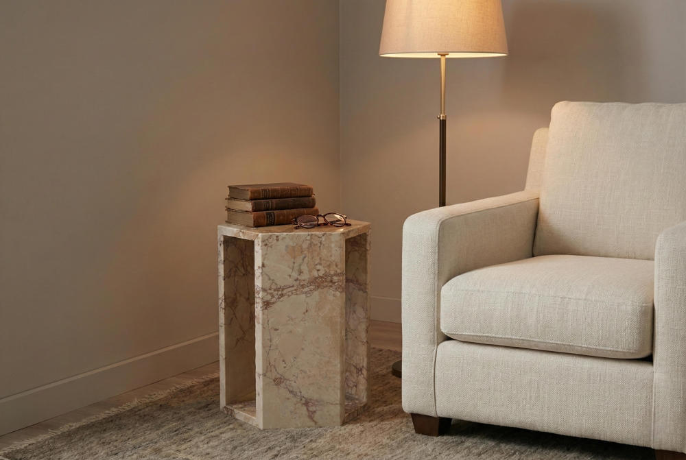 Cozy reading nook featuring the solid pink marble accent table beside an armchair, offering a sturdy, no-assembly-required surface for books and glasses.