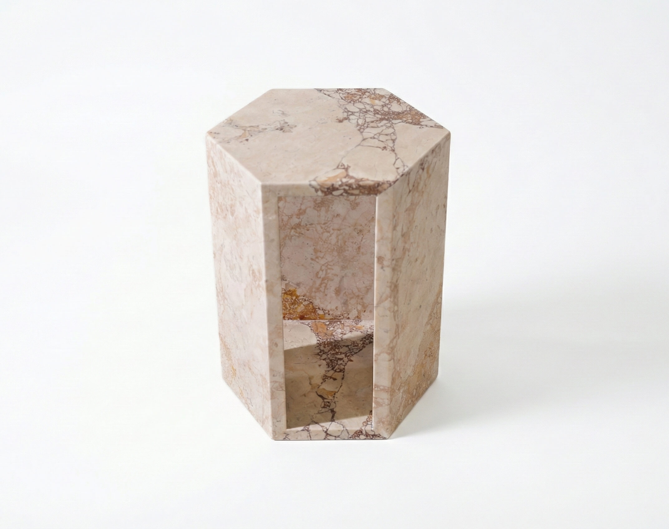 Top-down perspective of the solid natural marble hexagon pedestal, showcasing its one-of-a-kind veining and modern geometric shape.