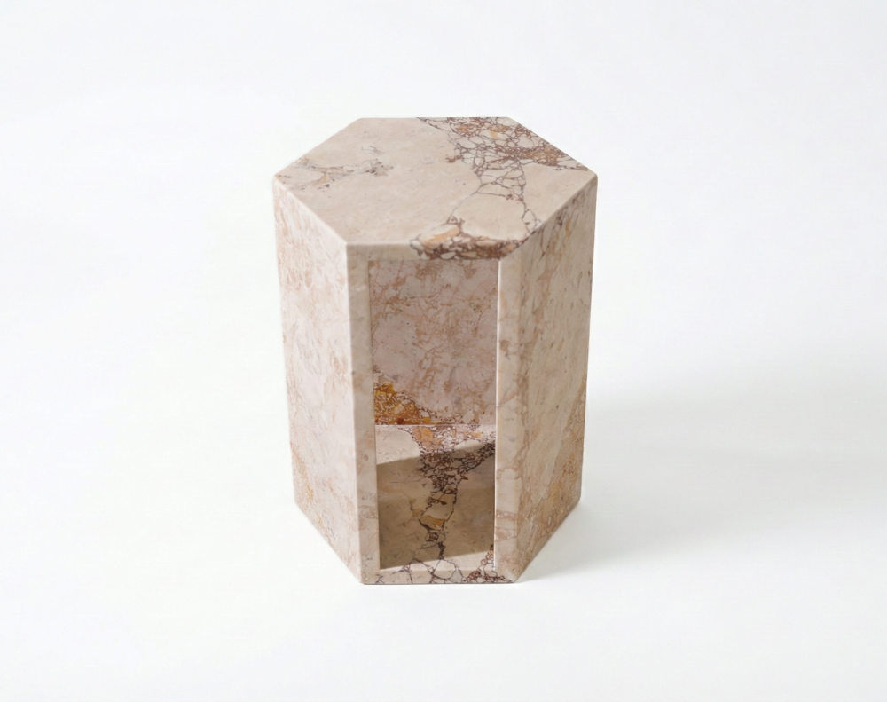 Top-down perspective of the solid natural marble hexagon pedestal, showcasing its one-of-a-kind veining and modern geometric shape.