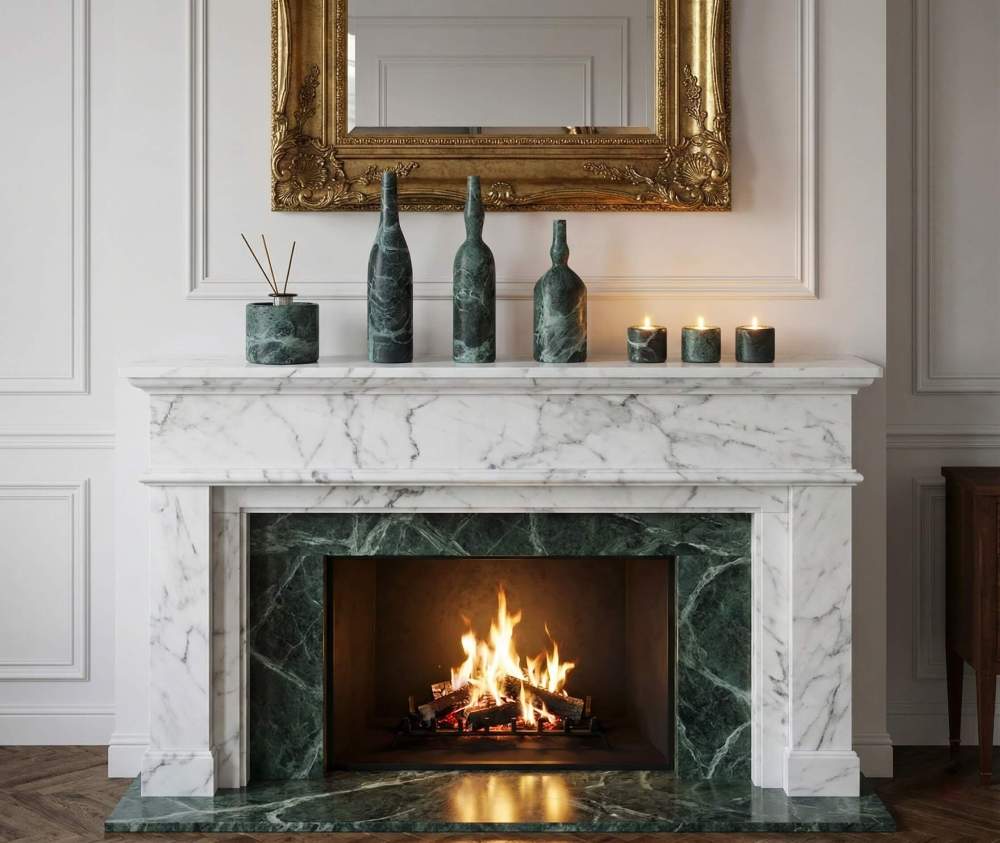 Luxury fireplace mantel decor featuring green marble vases and candle holders styled on a white marble hearth with a gold mirror.