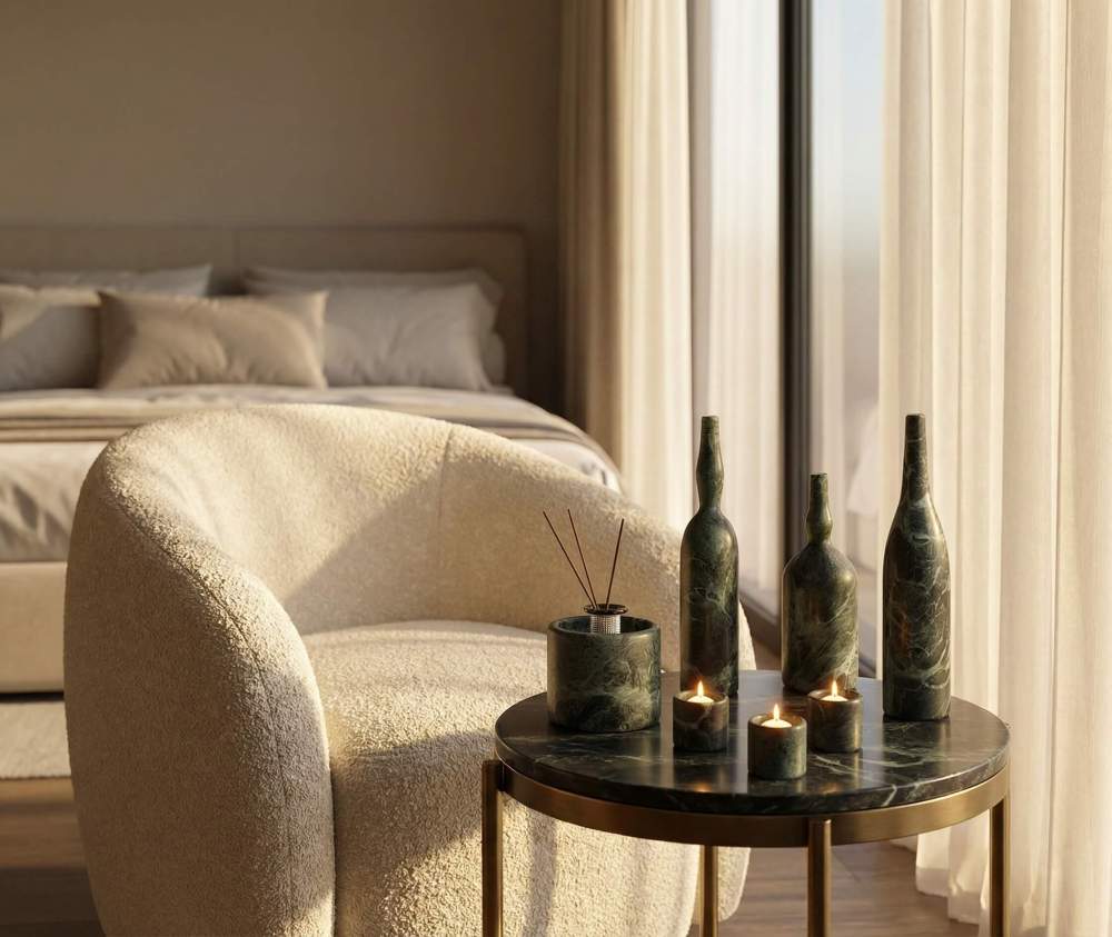 7-piece natural marble home decor set elegantly styled on a bedroom side table during the daytime, showcasing its unique emerald veining.