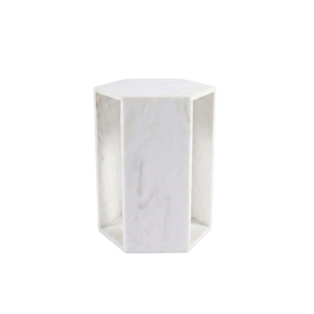 Front view of the natural white marble hexagon side table with a hollow center, showcasing unique grey veining and a honed matte finish.