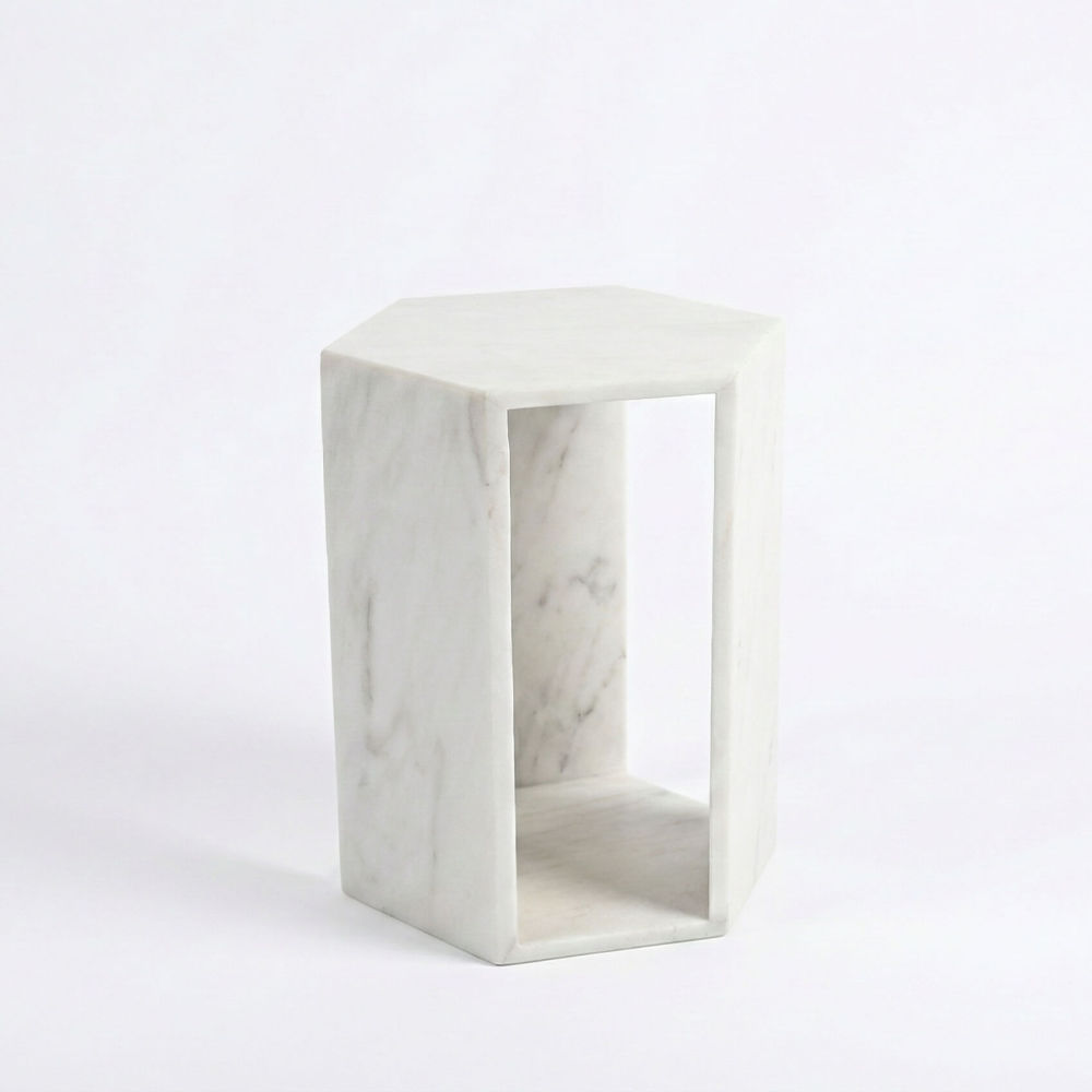 Side profile of the geometric Snow Mountain white marble end table, crafted from 100% natural stone with a modern minimalist hollow design.