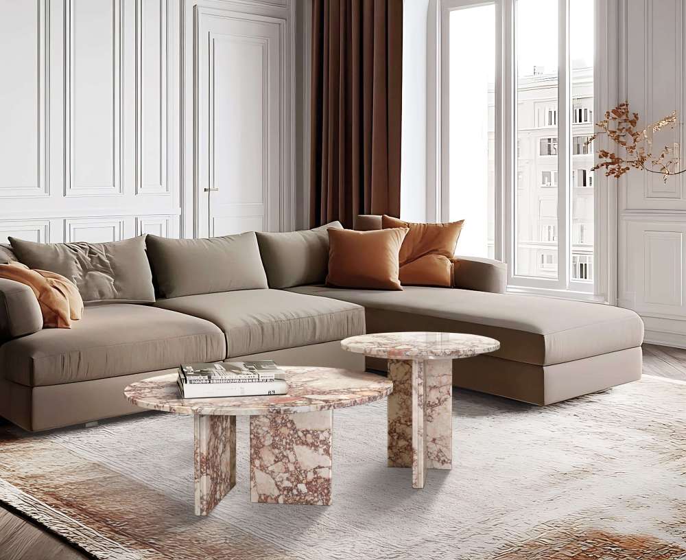 Diamond pink natural marble nesting tables set of 2, styled in a modern living room. 100% authentic stone with unique veining complementing neutral brown decor.