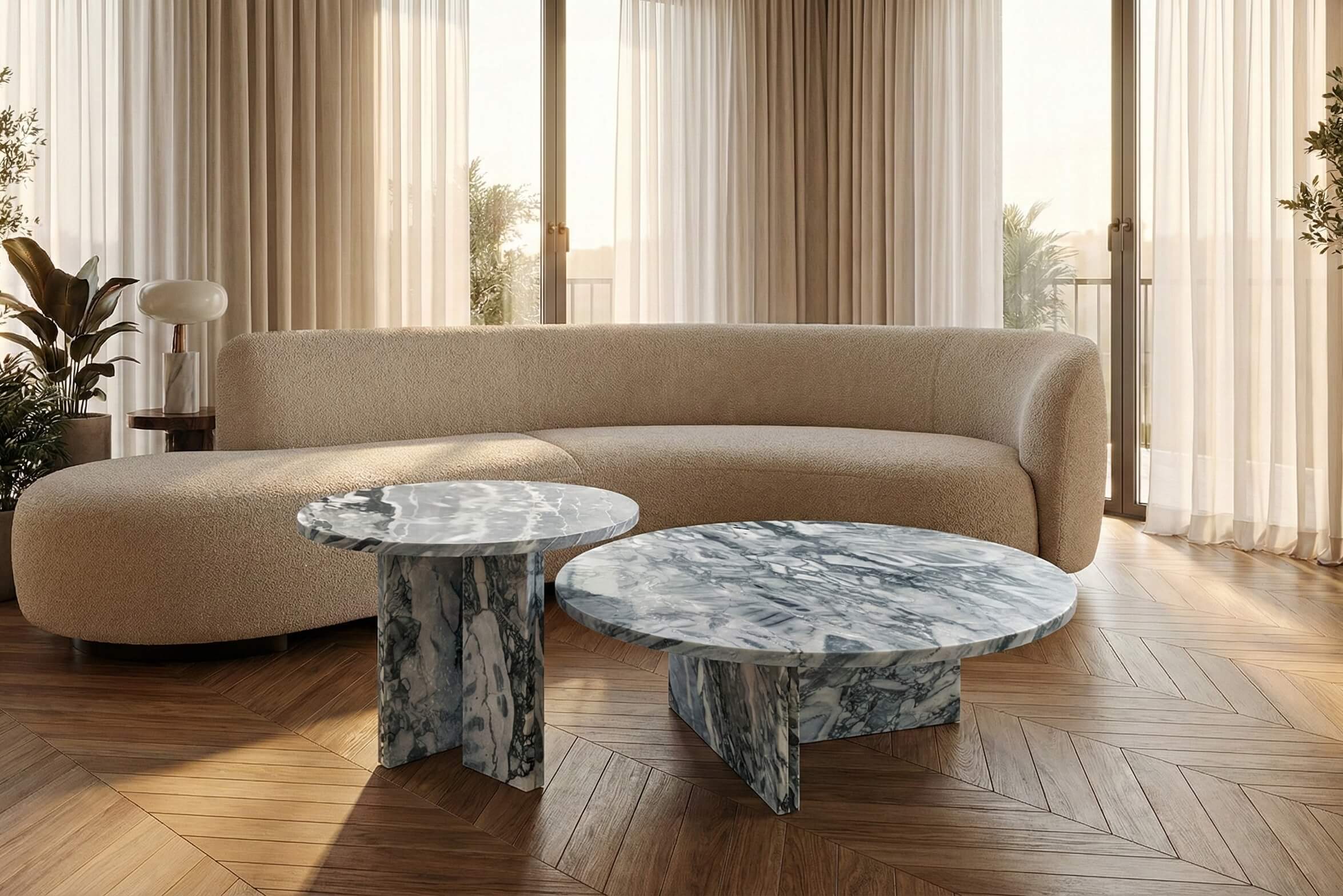 A contemporary living space showcasing the 100% natural marble nesting tables. Every single piece features one-of-a-kind grey-blue stone veins and natural patterns.