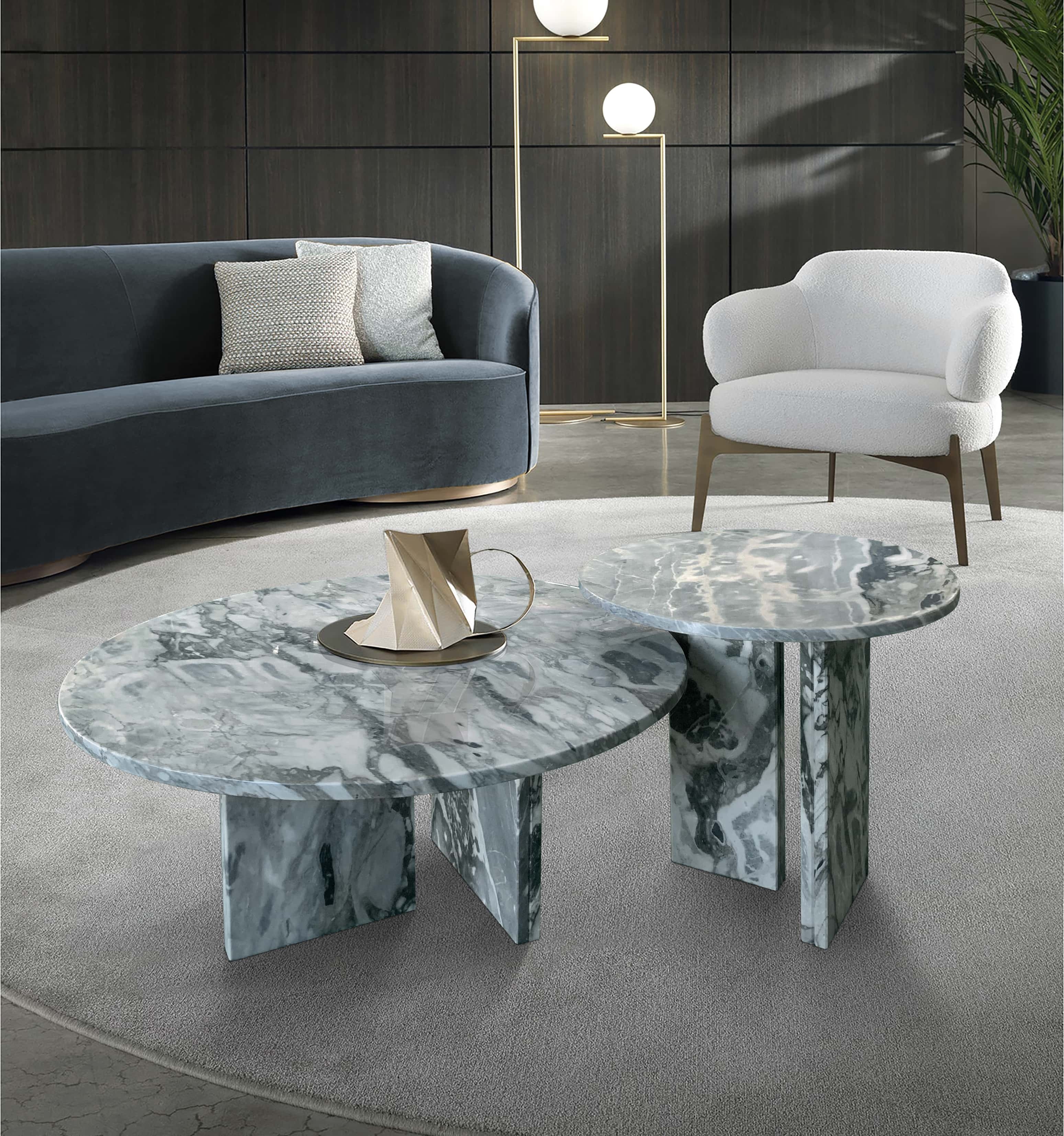 Elegant living room centerpiece featuring the two-piece marble nesting table set. Upgrade your space with high-end luxury furniture and unique natural stone textures.