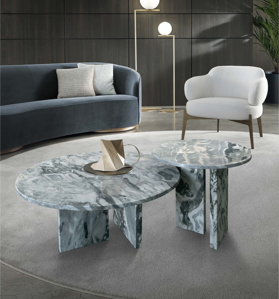 Elegant living room centerpiece featuring the two-piece marble nesting table set. Upgrade your space with high-end luxury furniture and unique natural stone textures.