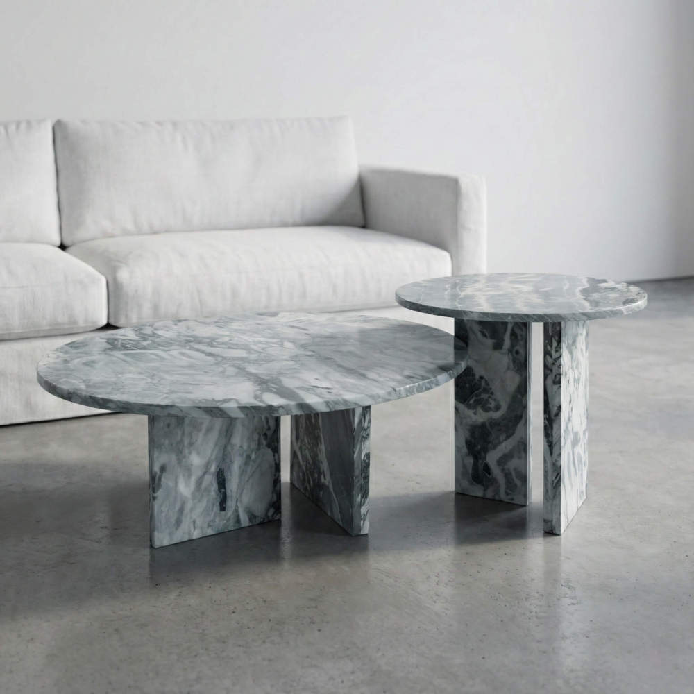 Side angle of the luxury Cloudy Blue marble round coffee tables enhancing a minimalist interior design, highlighting the natural stone's elegance and easy assembly structure.