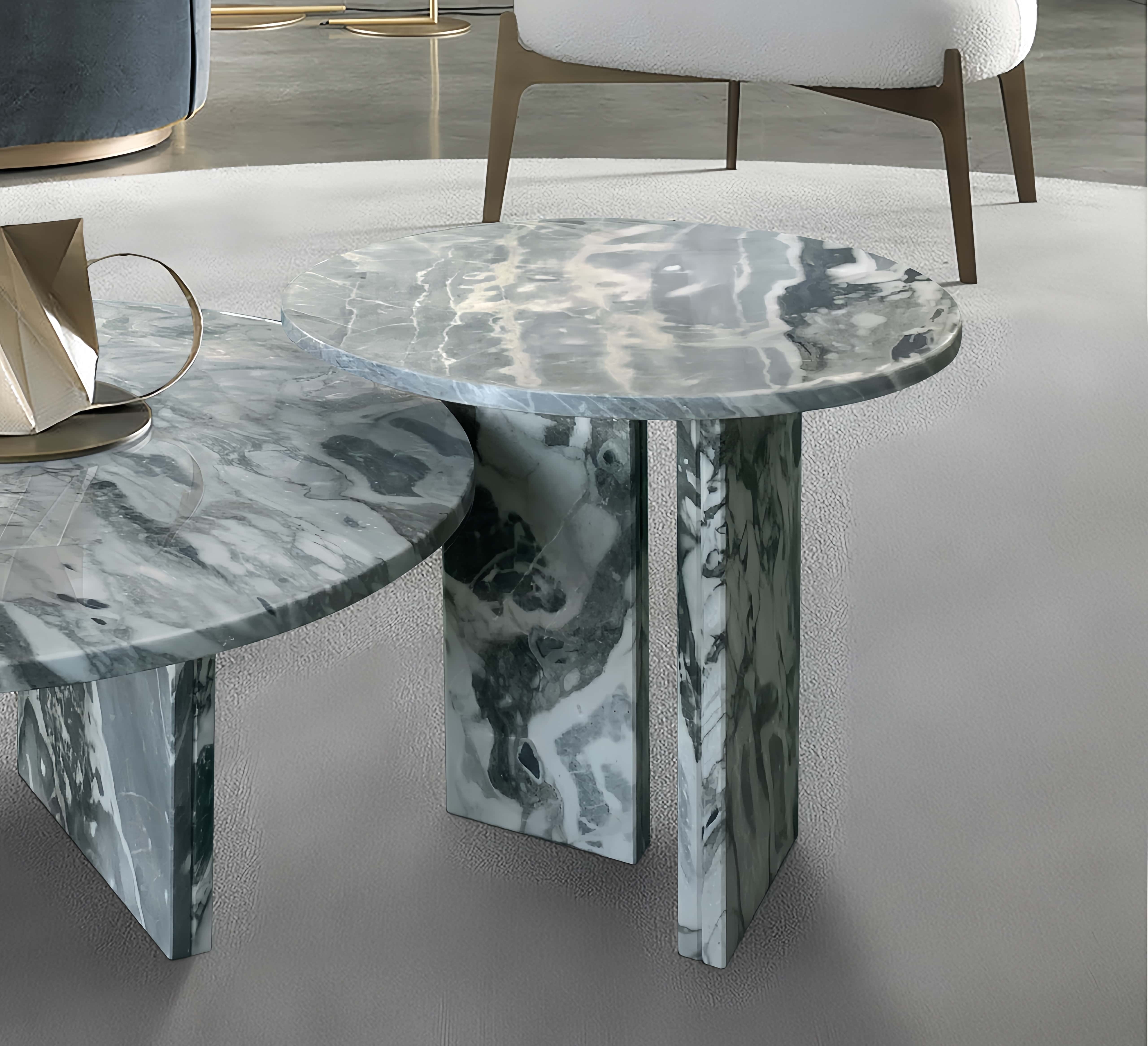 Detailed view of the 45cm side table gracefully nesting over the larger table. The sturdy geometric marble bases are uniquely patterned and designed for incredibly easy assembly.