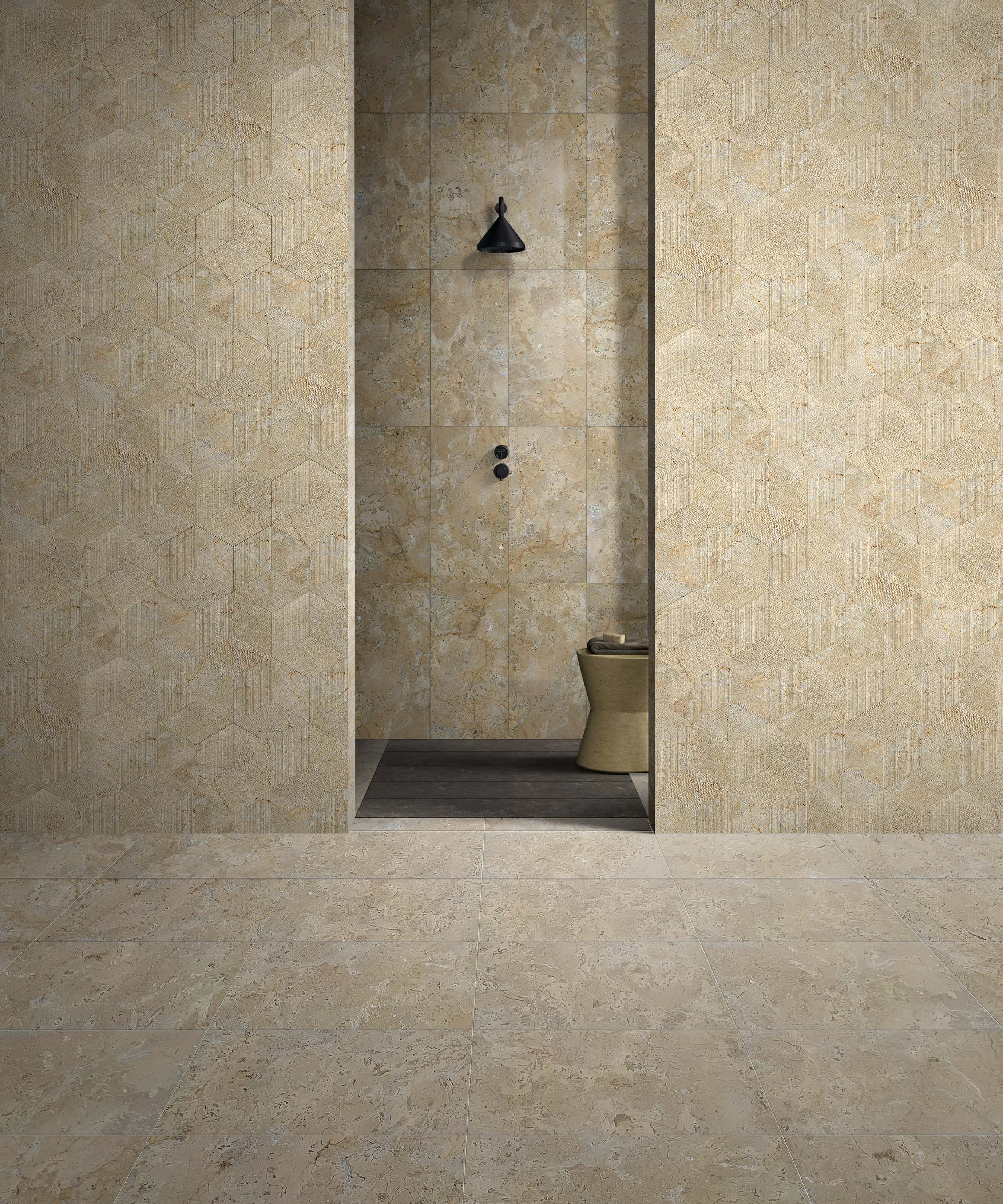 Stunning bathroom design featuring a versatile mix of Hyatt Gold natural marble: 12x24 honed finish tiles on the floor, 12x24 polished tiles on the center wall, and textured hexagon tiles on the side walls, showcasing 100% exclusive natural stone.