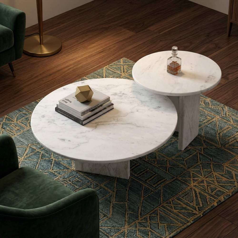 Top-down view of the 2-piece round white marble coffee table set, styled in a luxury dark-toned living room with a green velvet chair.