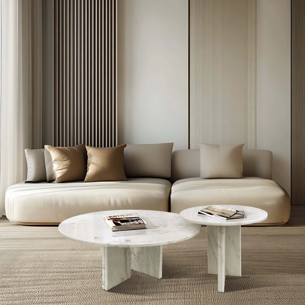 Snow Mountain White marble nesting coffee tables styled in a luxury modern living room with a neutral minimalist sofa.