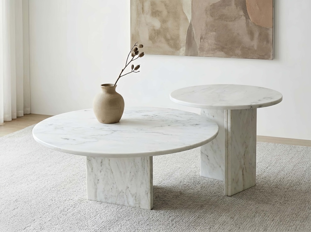Scandinavian style interior featuring the unique, one-of-a-kind veining of the natural Snow Mountain White marble round coffee tables.