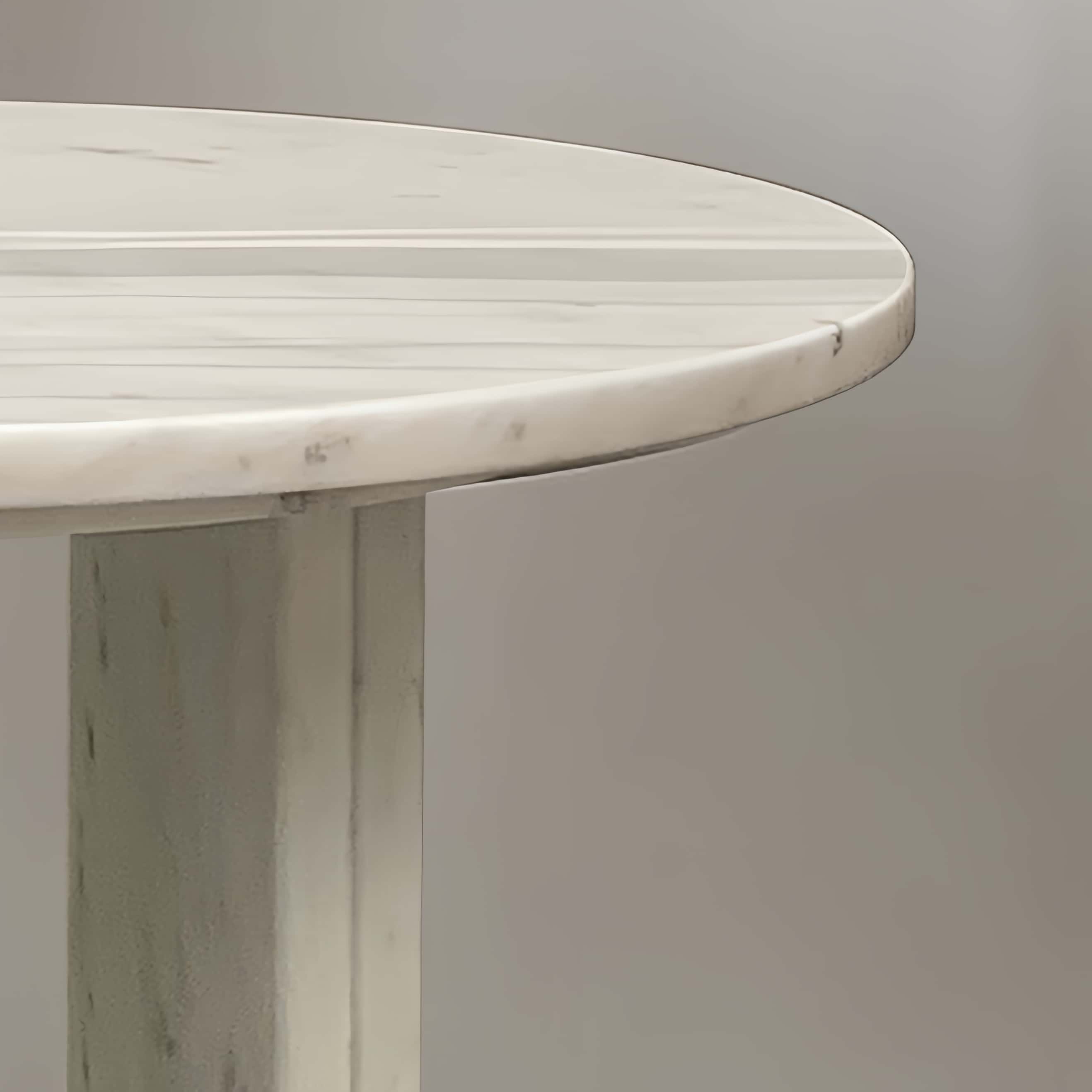 Close-up detail of the smooth edge and sturdy cross-base craftsmanship on the 100% natural exclusive white marble coffee table.