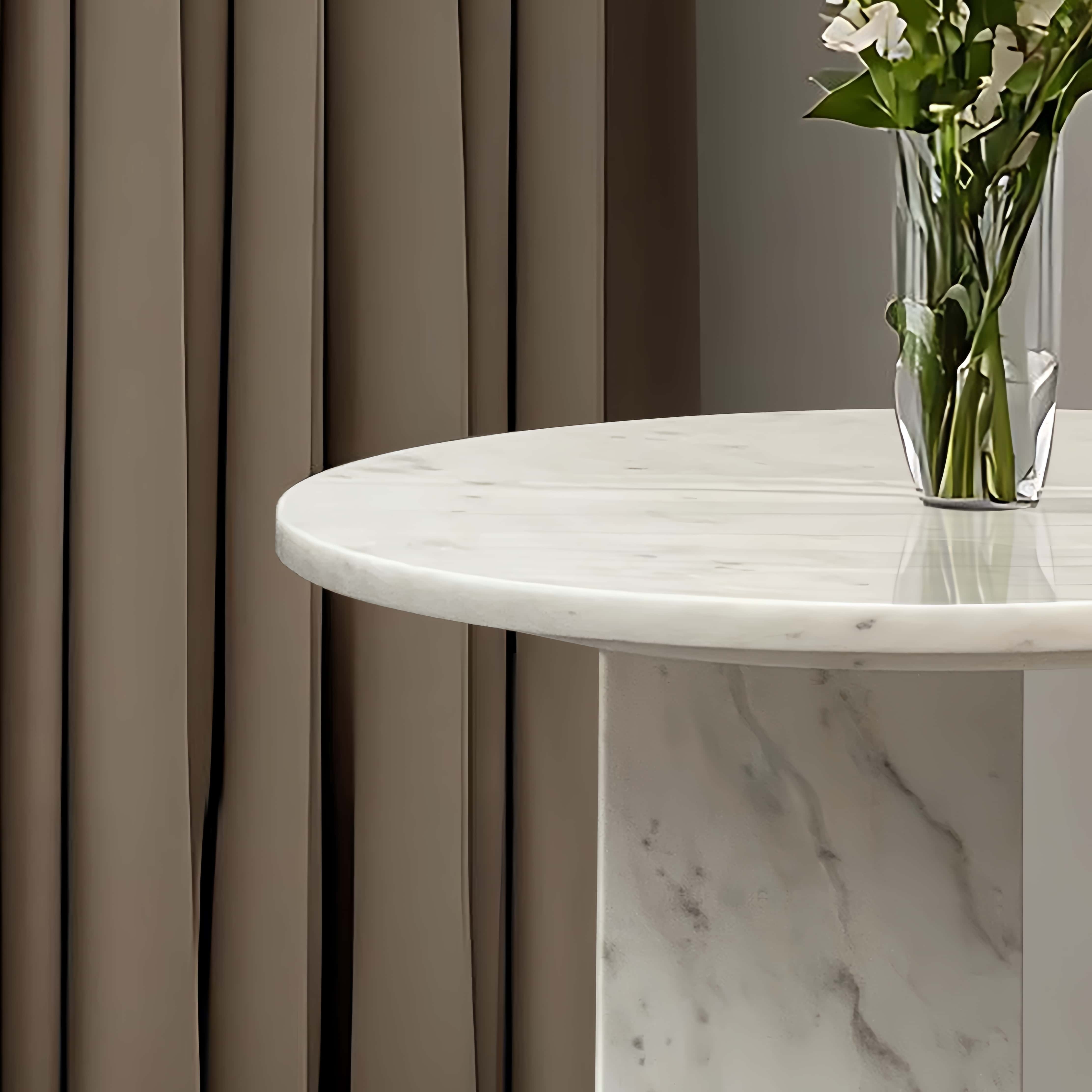 Close-up of the snow mountain white marble table top featuring unique natural stone veining, ensuring no two pieces are exactly alike.