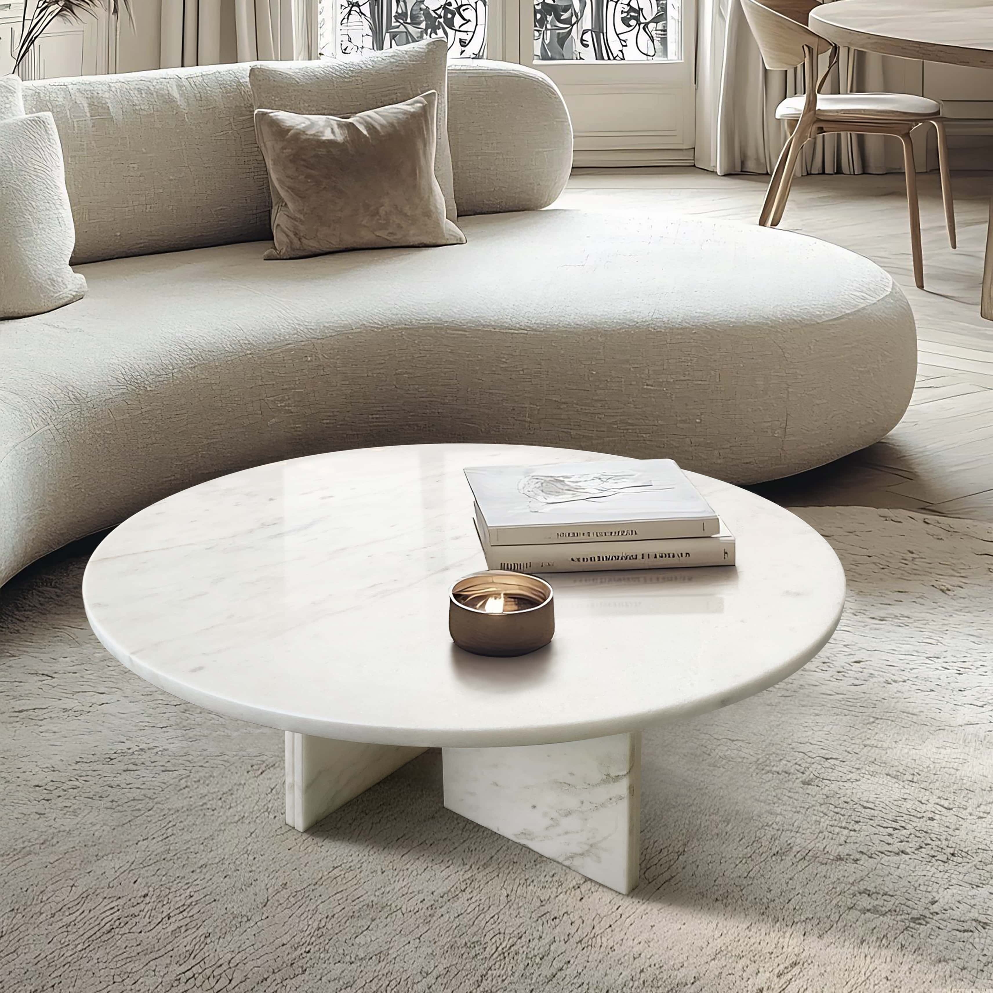 Elegant lifestyle setup featuring the 27.6-inch round marble coffee table paired with a curved textured sofa, showcasing functional art for luxurious home decor.