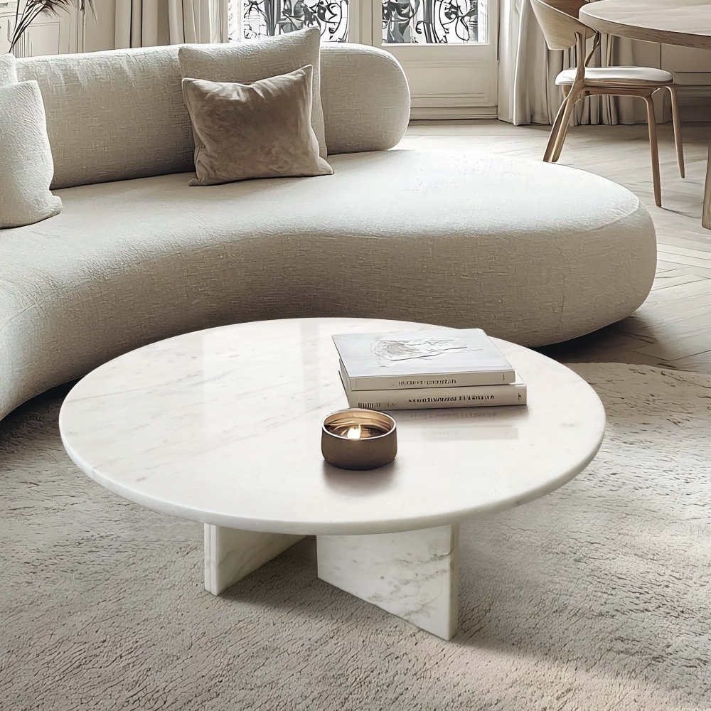 Elegant lifestyle setup featuring the 27.6-inch round marble coffee table paired with a curved textured sofa, showcasing functional art for luxurious home decor.