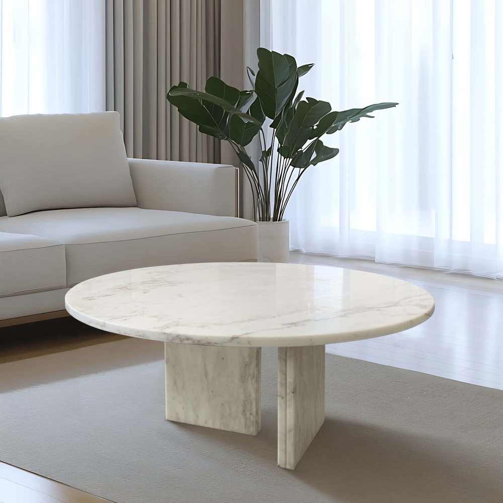 Snow Mountain White marble coffee table styled as a stunning centerpiece in a modern, light-filled living room. Enjoy free shipping on this genuine natural stone furniture.
