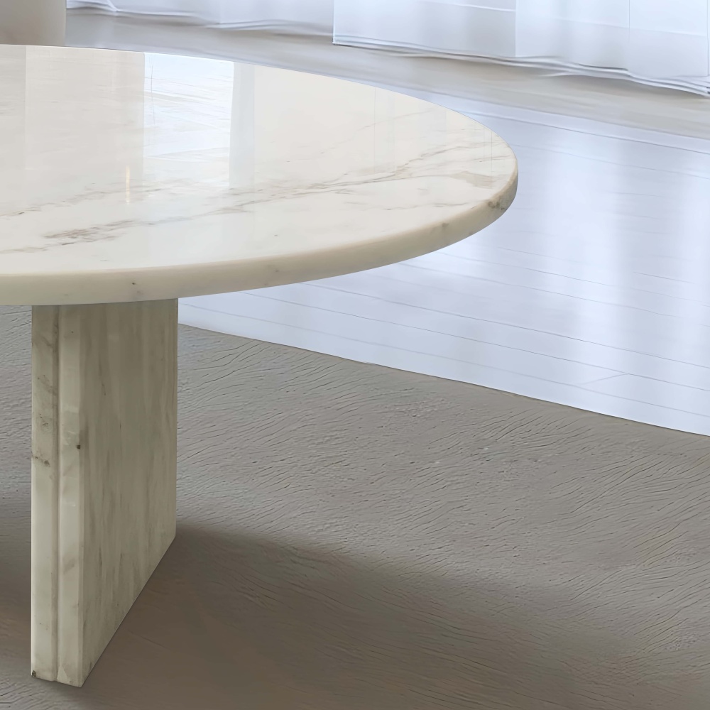 Close-up detail of the semi-polished surface and sturdy geometric base of the Snow Mountain White marble coffee table, highlighting premium craftsmanship and solid structure.