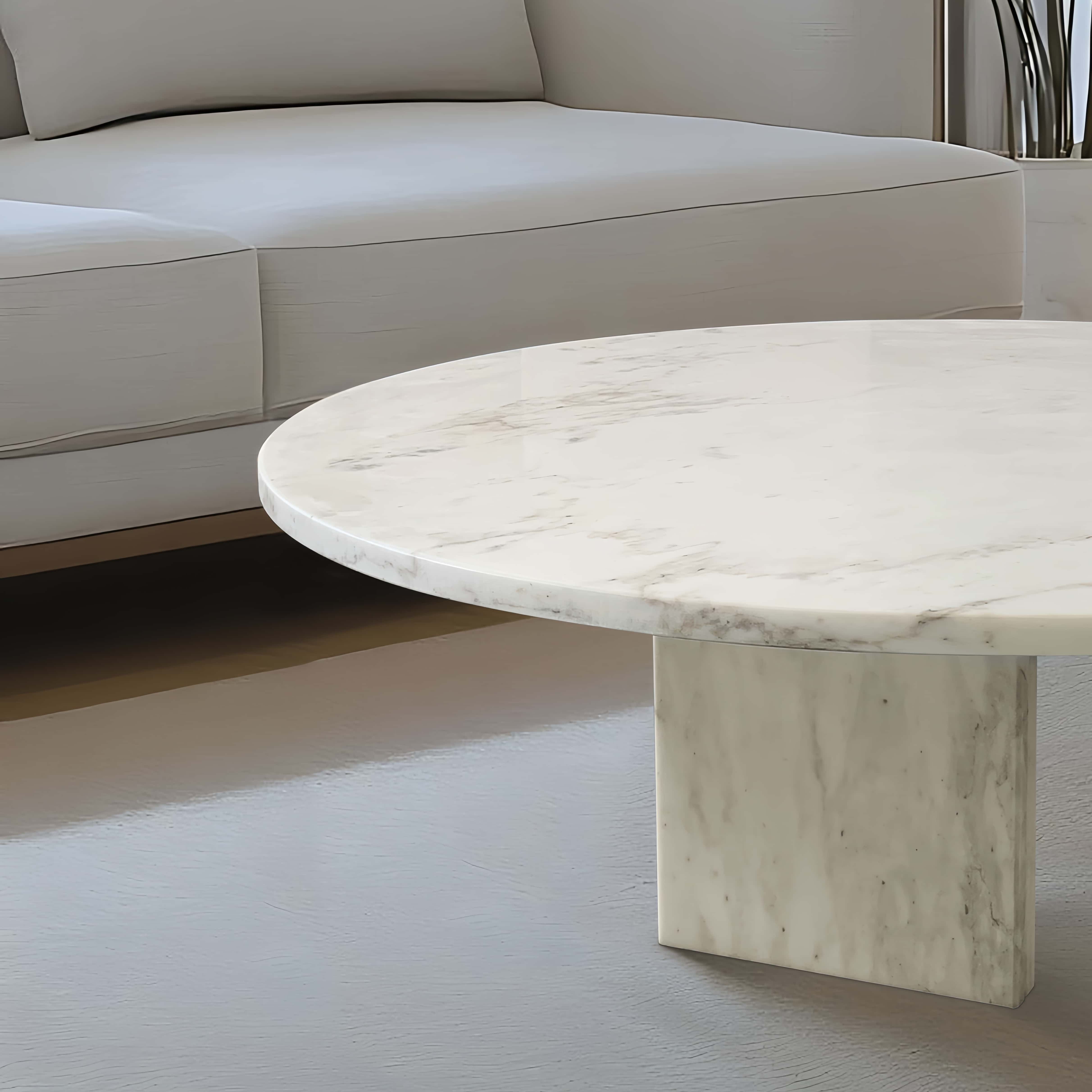 Detailed view of the distinctive natural veining on the Snow Mountain White marble coffee table top. Every single piece is a unique, one-of-a-kind functional art piece.