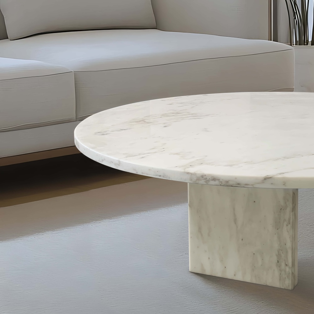 Detailed view of the distinctive natural veining on the Snow Mountain White marble coffee table top. Every single piece is a unique, one-of-a-kind functional art piece.