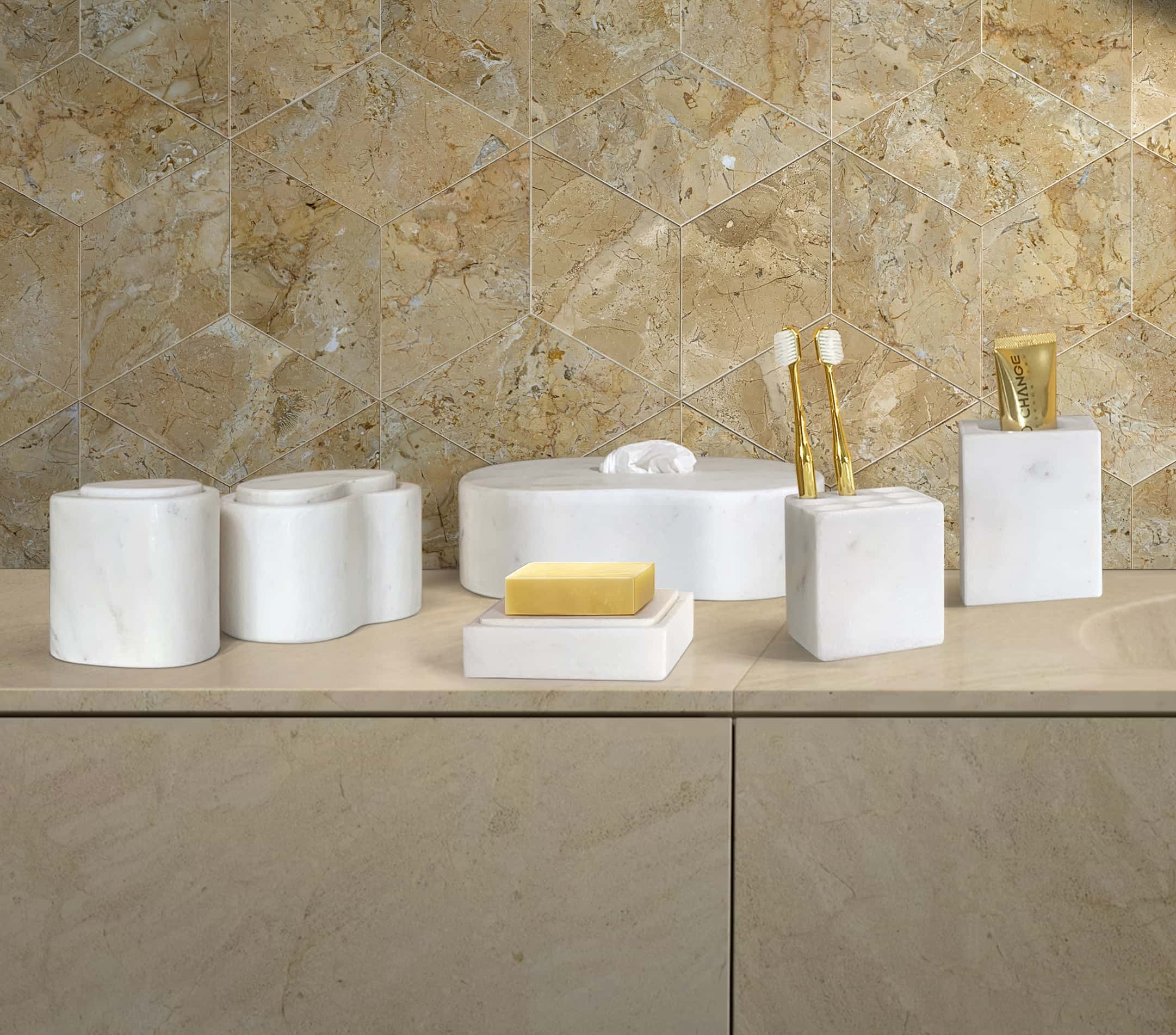 Close-up view of the elegant Snow Mountain White marble bathroom accessories, beautifully contrasting with the premium Hyatt Gold hexagon polished tile backsplash.