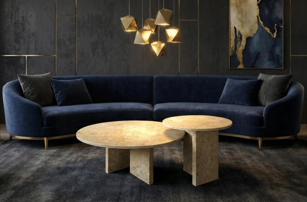 The Hyatt gold-beige natural marble coffee tables contrast beautifully against a dark luxury interior with a blue velvet sofa. Each easy-to-assemble piece features one-of-a-kind natural veining.