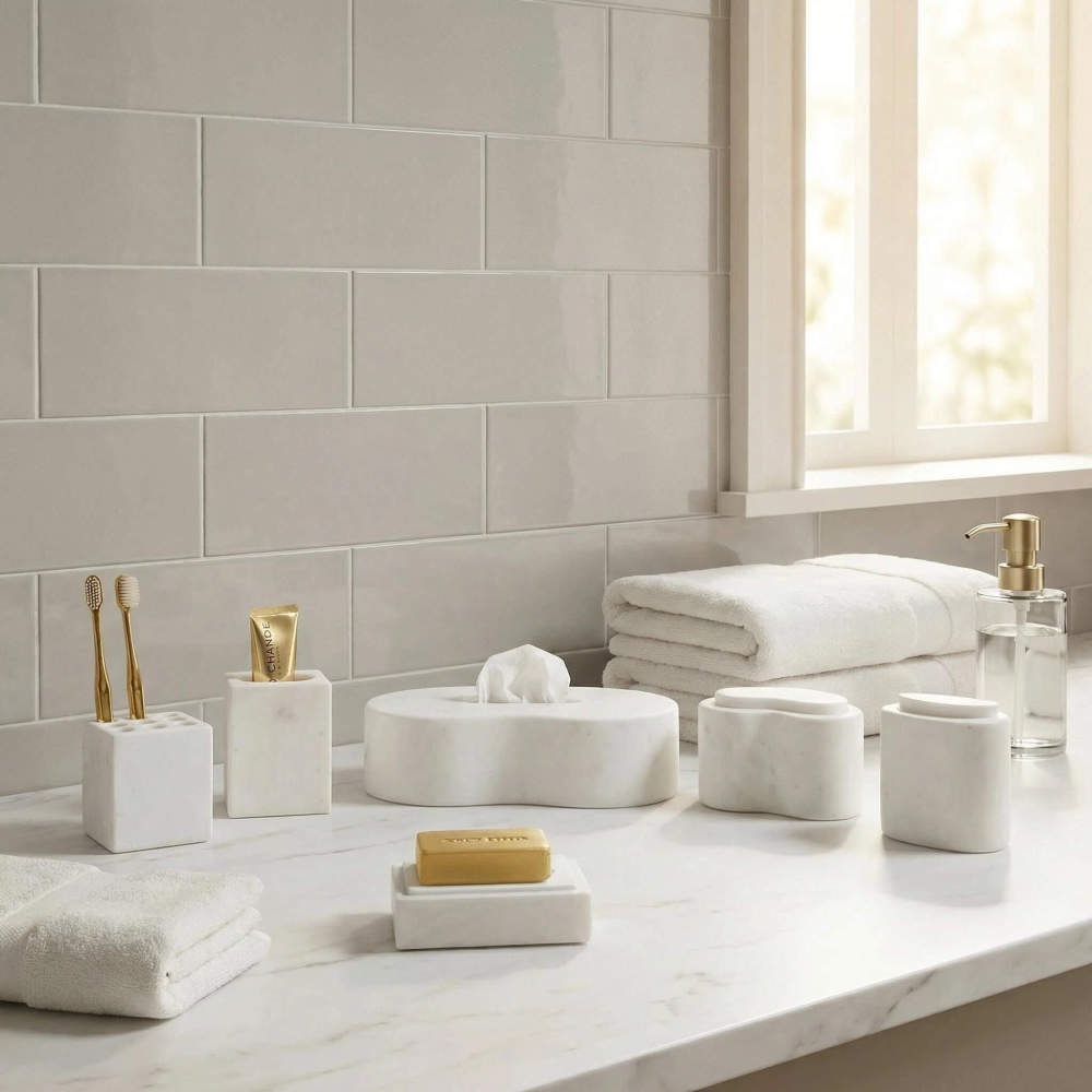 The elegant Snow Mountain White natural marble 6-piece bathroom vanity set styled on a modern bathroom countertop, showcasing luxury home decor inspiration.