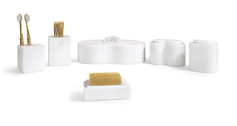 Styled Snow Mountain White natural marble bathroom organizer set holding toothbrushes, soap, and tissue, showcasing real-world application on a vanity.