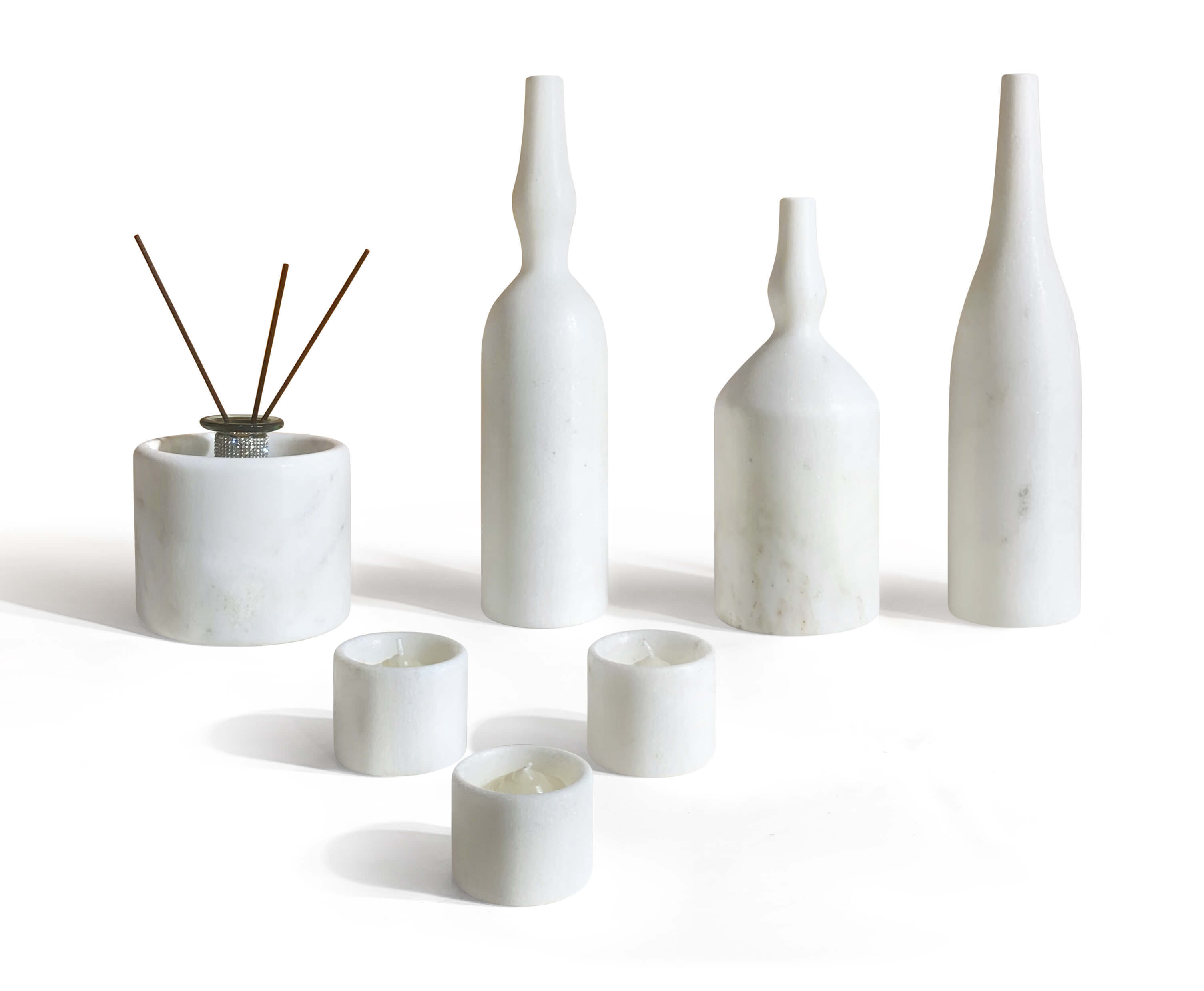 Snow Mountain White marble reed diffuser bottle holder and three tealight candle holders. Every natural marble piece is unique. Easy to assemble and arrange.