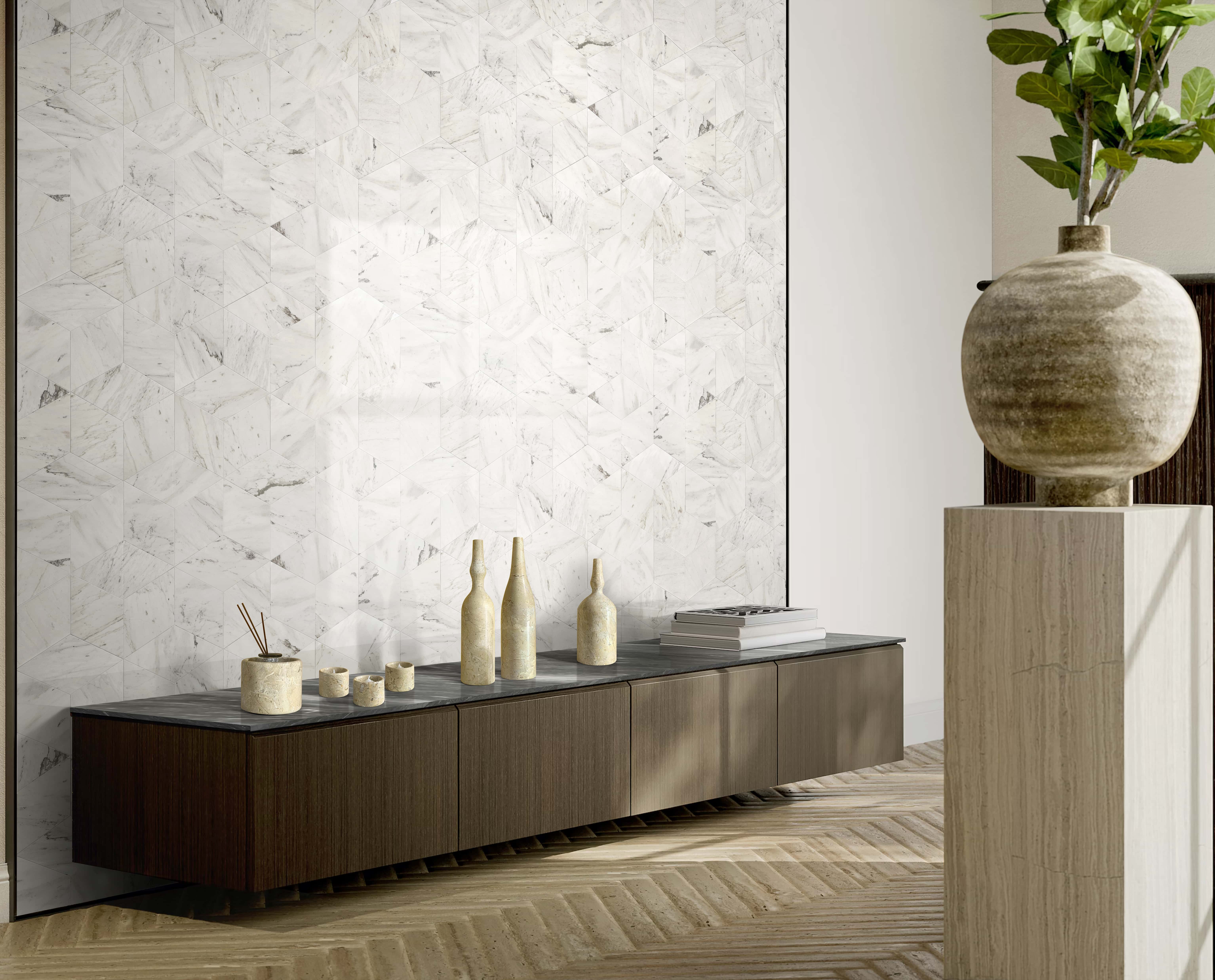 Luxury living room interior design featuring a Snow Mountain White polished hexagon marble tile feature wall, elegantly contrasted by the 7-piece Hyatt Gold matte natural marble decor set on a low console cabinet.