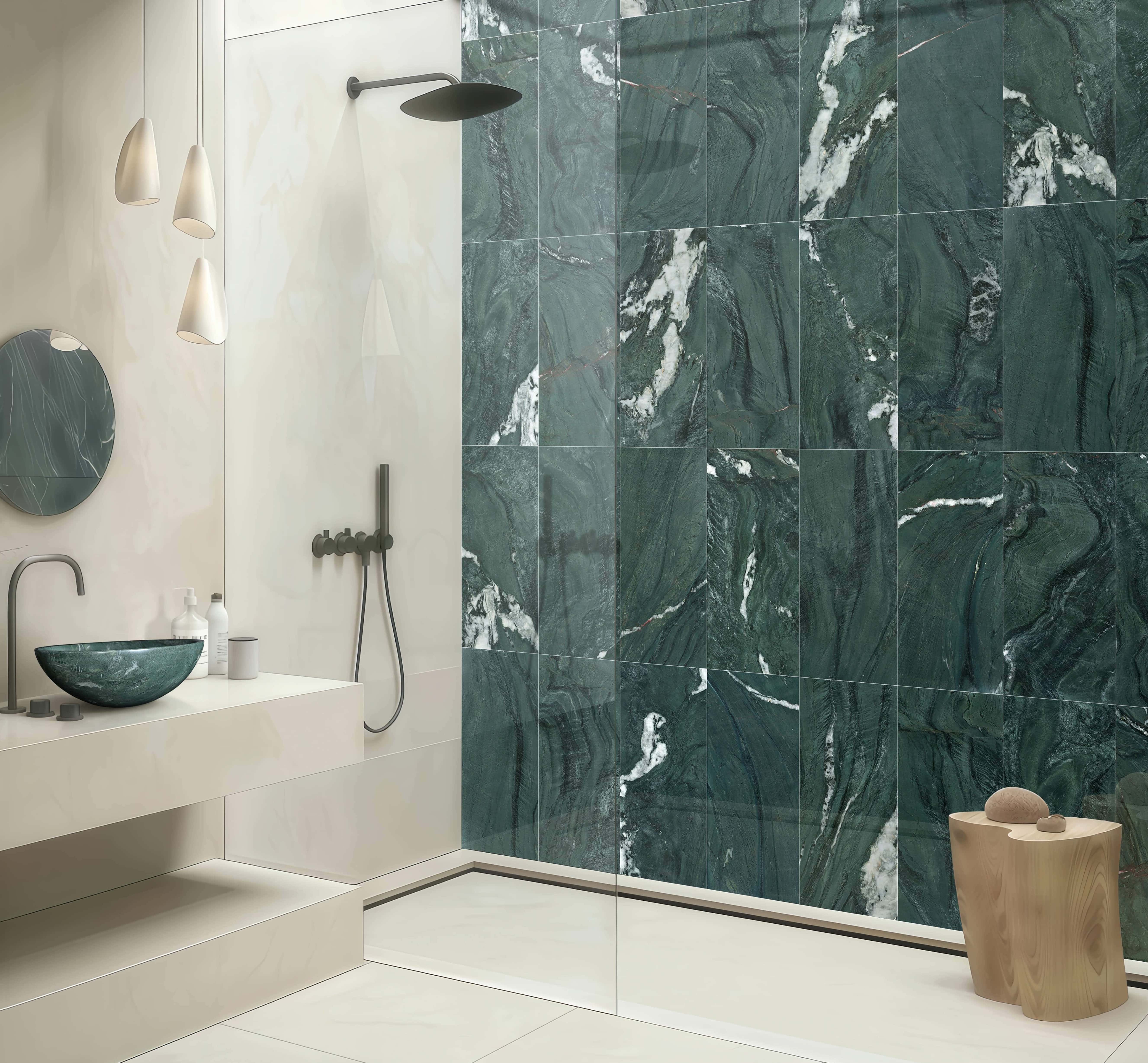 A cohesive luxury bathroom design featuring the round diamond green marble vessel sink paired perfectly with matching 12x24 inch polished diamond green marble tiles on the shower wall.
