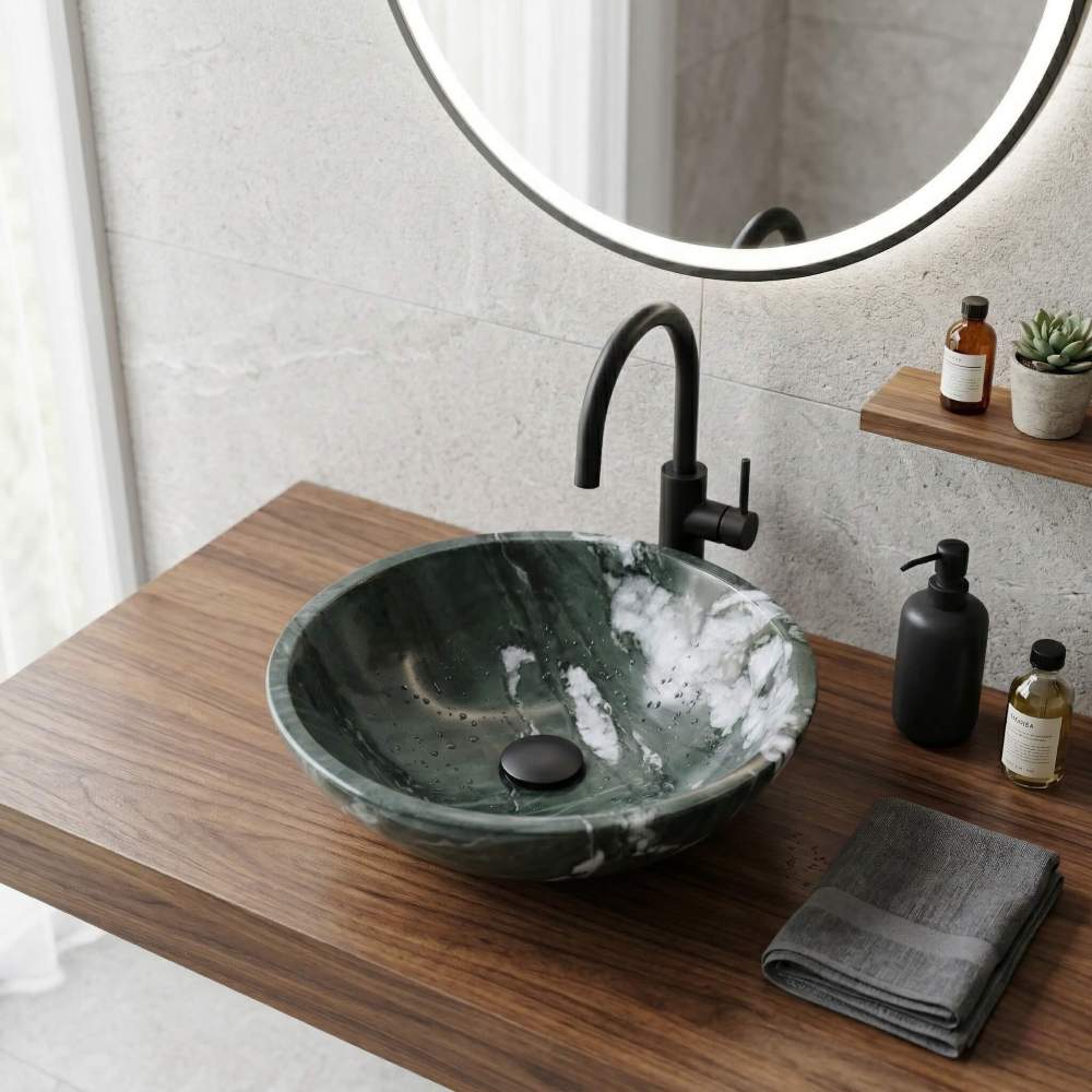 The authentic diamond green marble above-counter sink displayed in a high-end interior design layout, showcasing the striking contrast between its vibrant natural green veining and the surrounding bathroom decor.