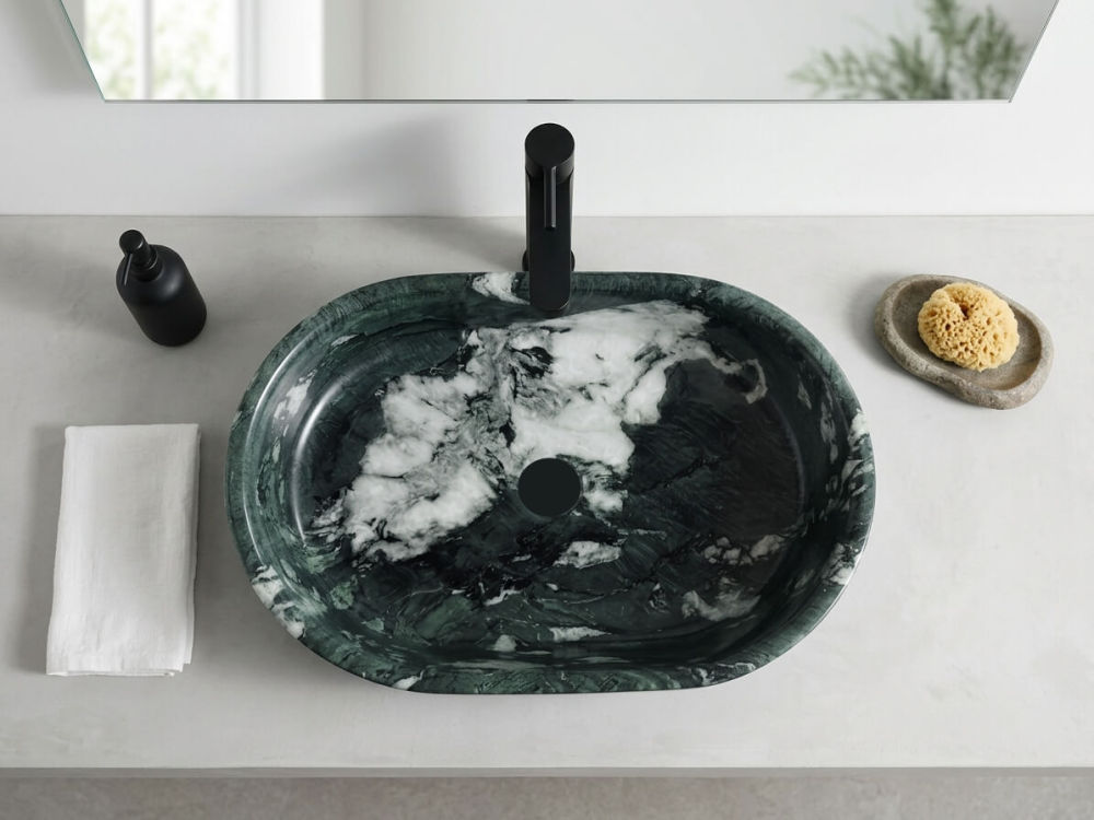 Top view of an oval Diamond Green marble vessel sink, highlighting the spacious basin and unique organic stone veining.