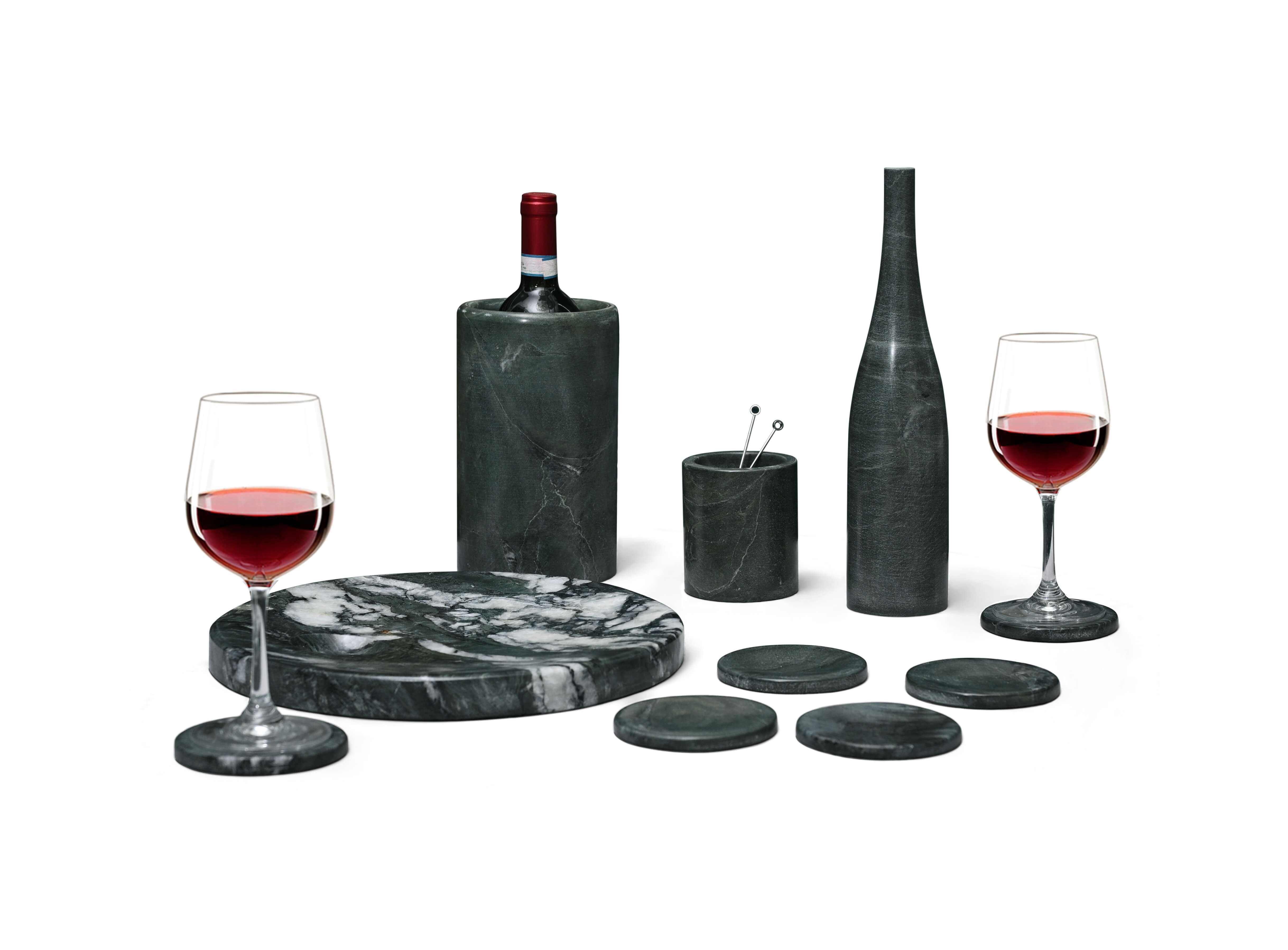 10-piece Diamond Green marble set featuring a wine bottle in the chiller, two red wine glasses on coasters, and olive picks in a container.