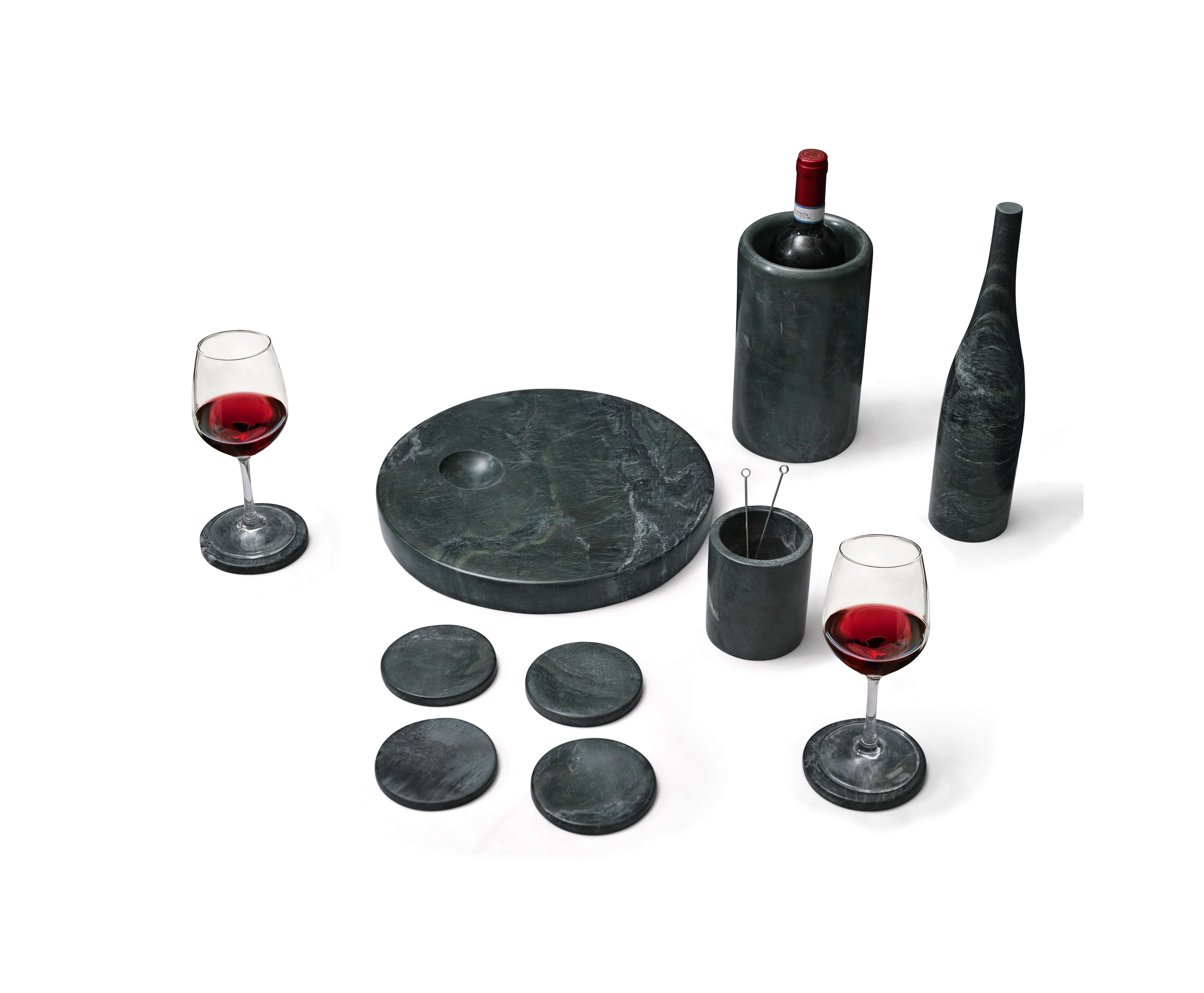 Diamond Green natural marble dining set with wine accessories and circular coasters, showcasing the organic patterns of 100% genuine stone.