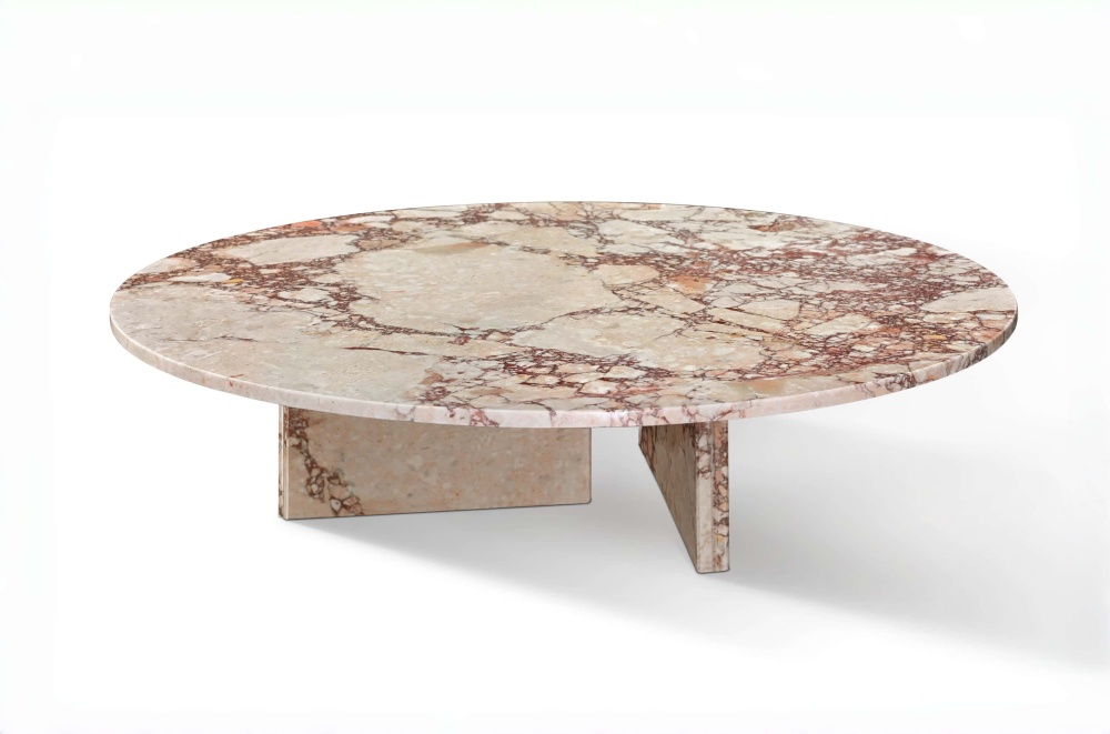 Side view of the low-profile pink marble coffee table showing the intersecting slab base construction and natural stone vein continuity.