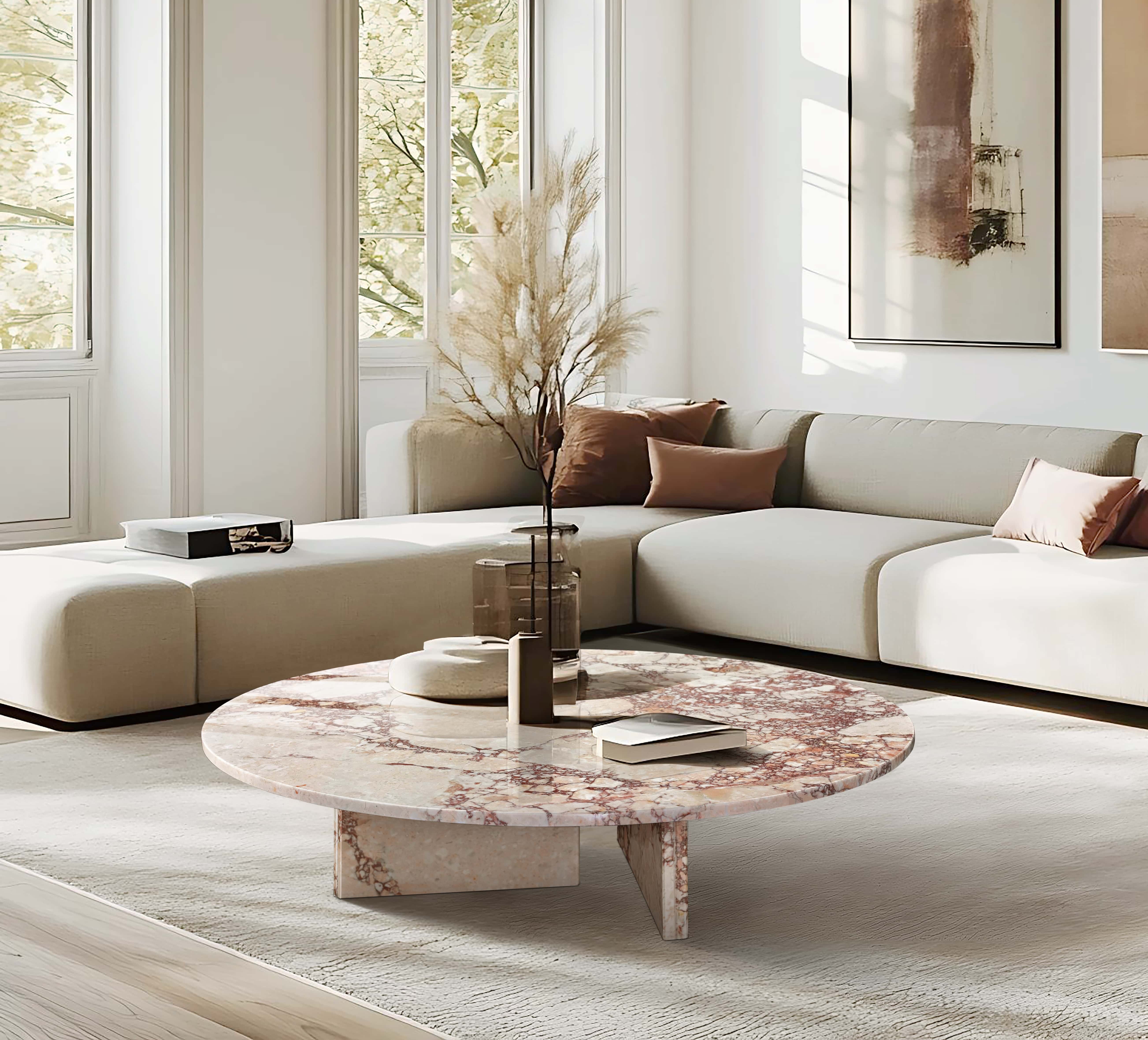 Sculptural 35-inch pink marble table defining the horizontal lines of a minimalist contemporary living space with neutral tones and soft natural light.