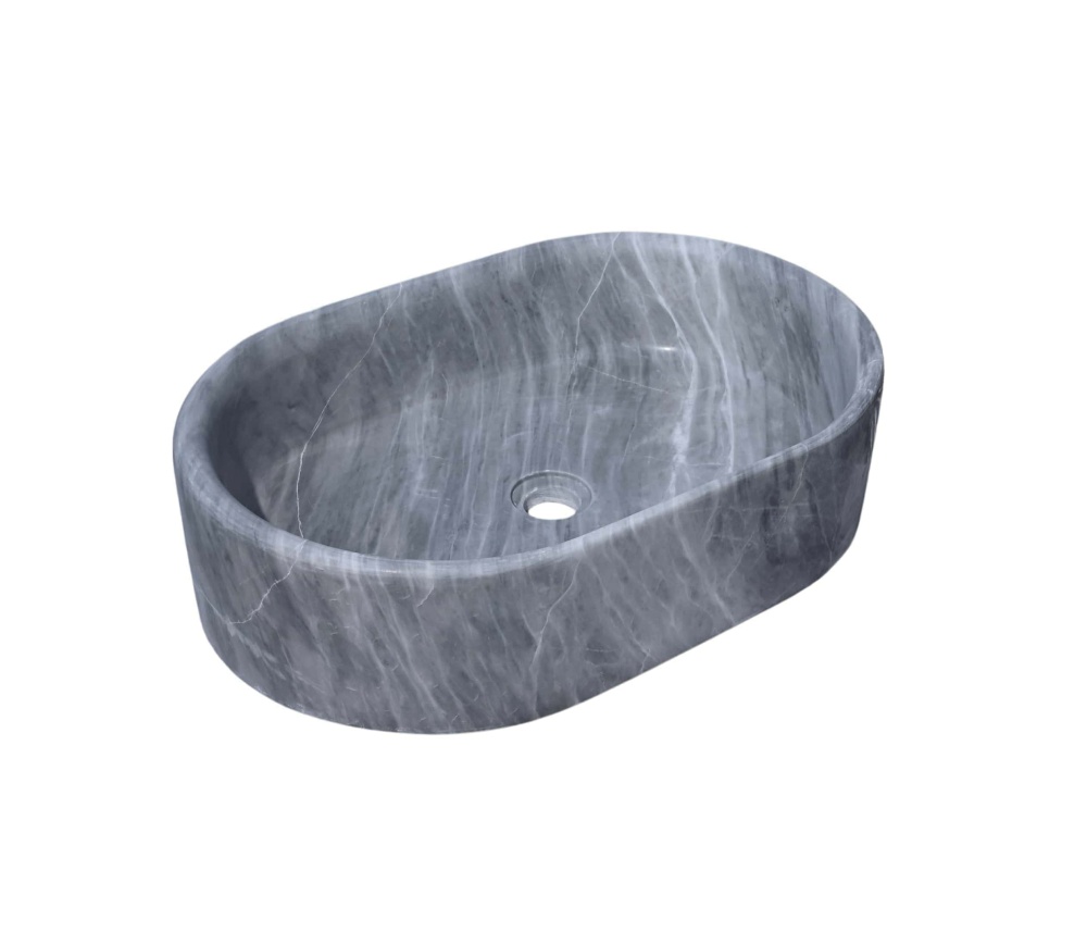 Three-quarter angle view of Carrara gray oval marble vessel sink, hand-honed finish revealing fine linear veining across the single-block carved exterior.