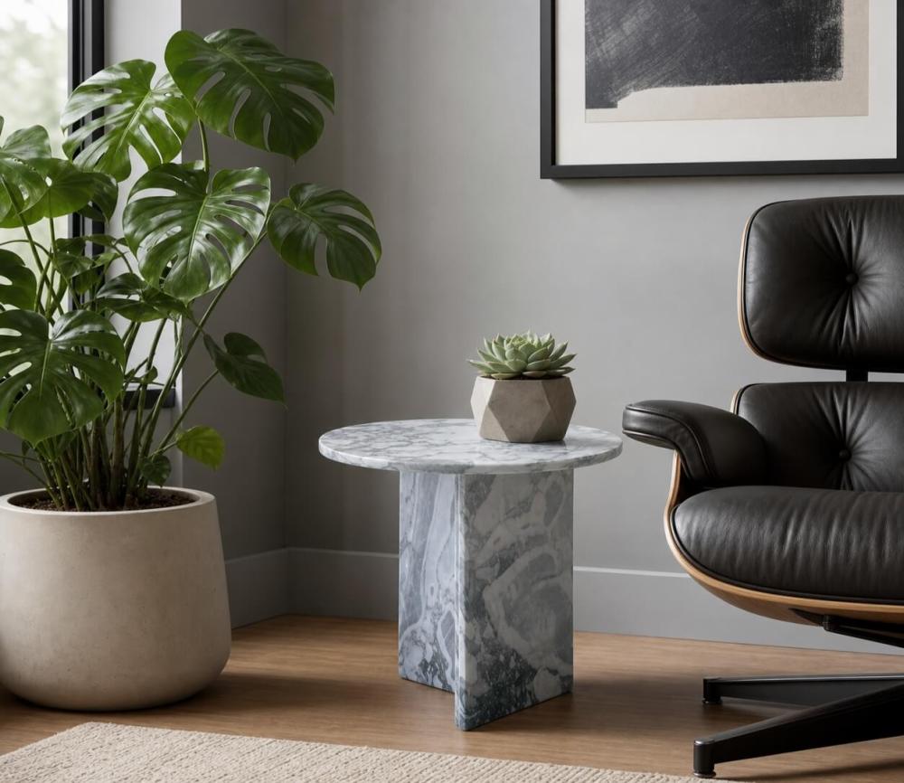 Cloudy blue marble side table in modern minimalist corner with classic Eames lounge chair, monstera plant, geometric concrete planter.
