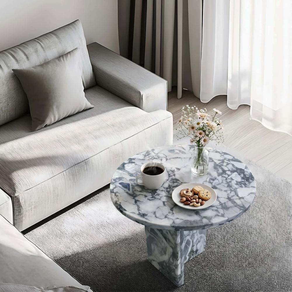 Cloudy blue marble side table in minimalist living room with linen sofa, morning coffee, fresh daisies, and natural light.