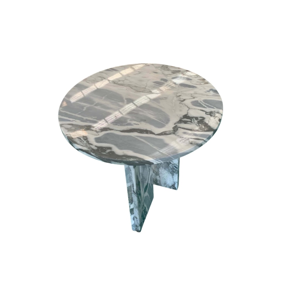 Cloudy blue natural marble side table viewed from 45-degree top angle, polished finish reflecting light, revealing full veining pattern on tabletop.