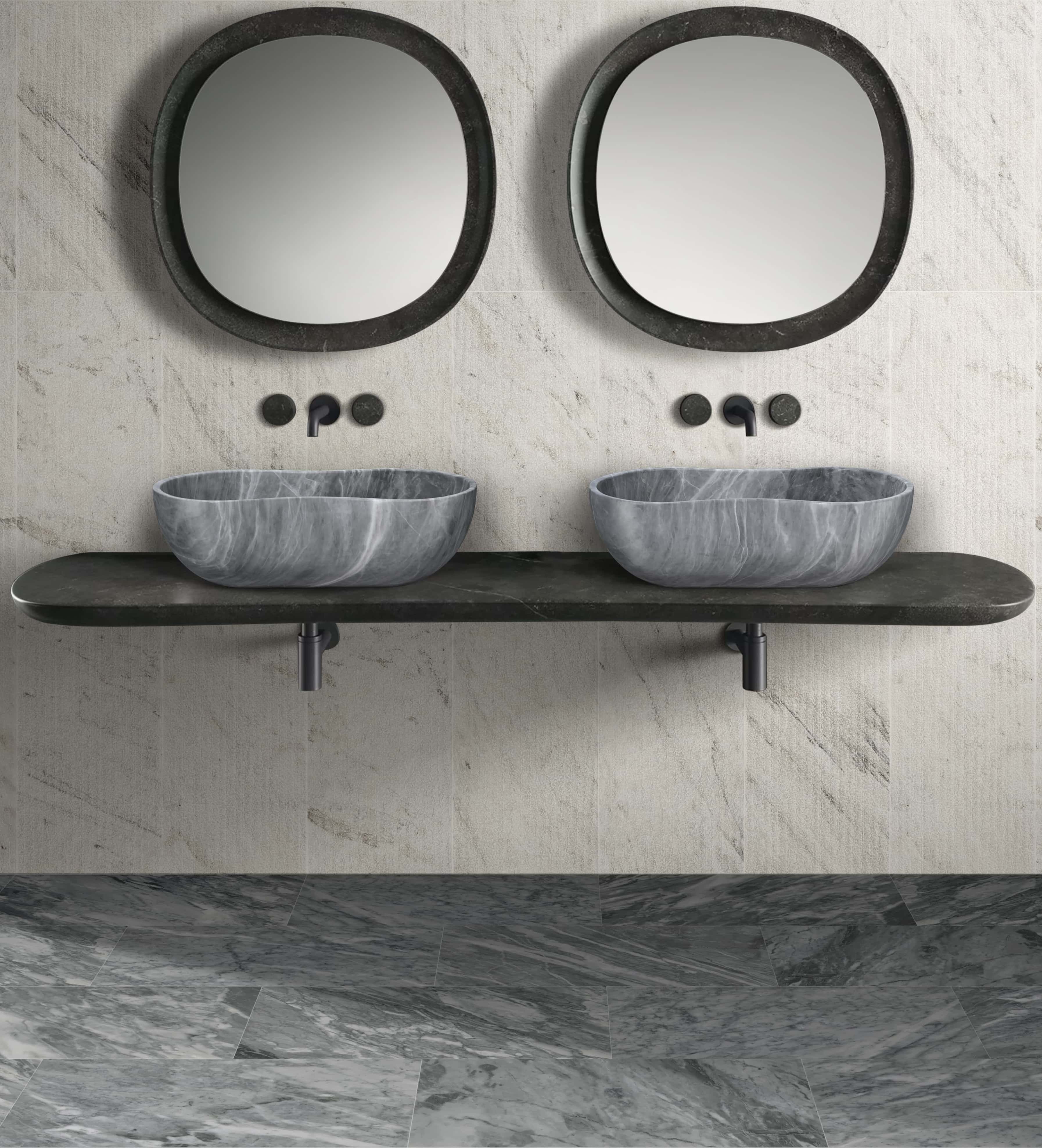 Two Carrara gray marble vessel sinks paired with matching 12x24 polished gray marble floor and snow mountain white textured wall tiles.
