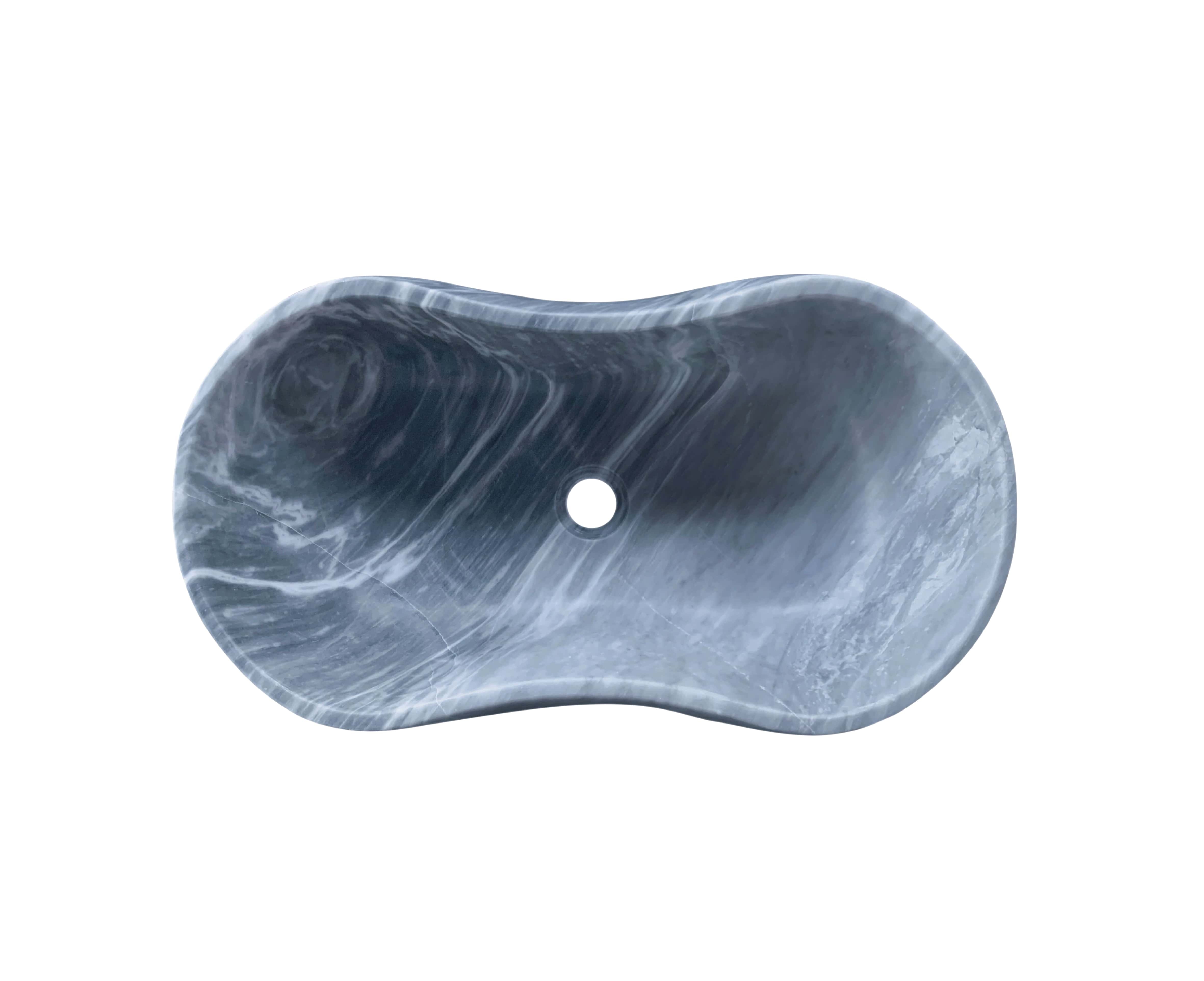 Overhead view of Carrara gray marble vessel sink showing concentric swirl pattern and dense white veining on hand-honed natural stone surface.