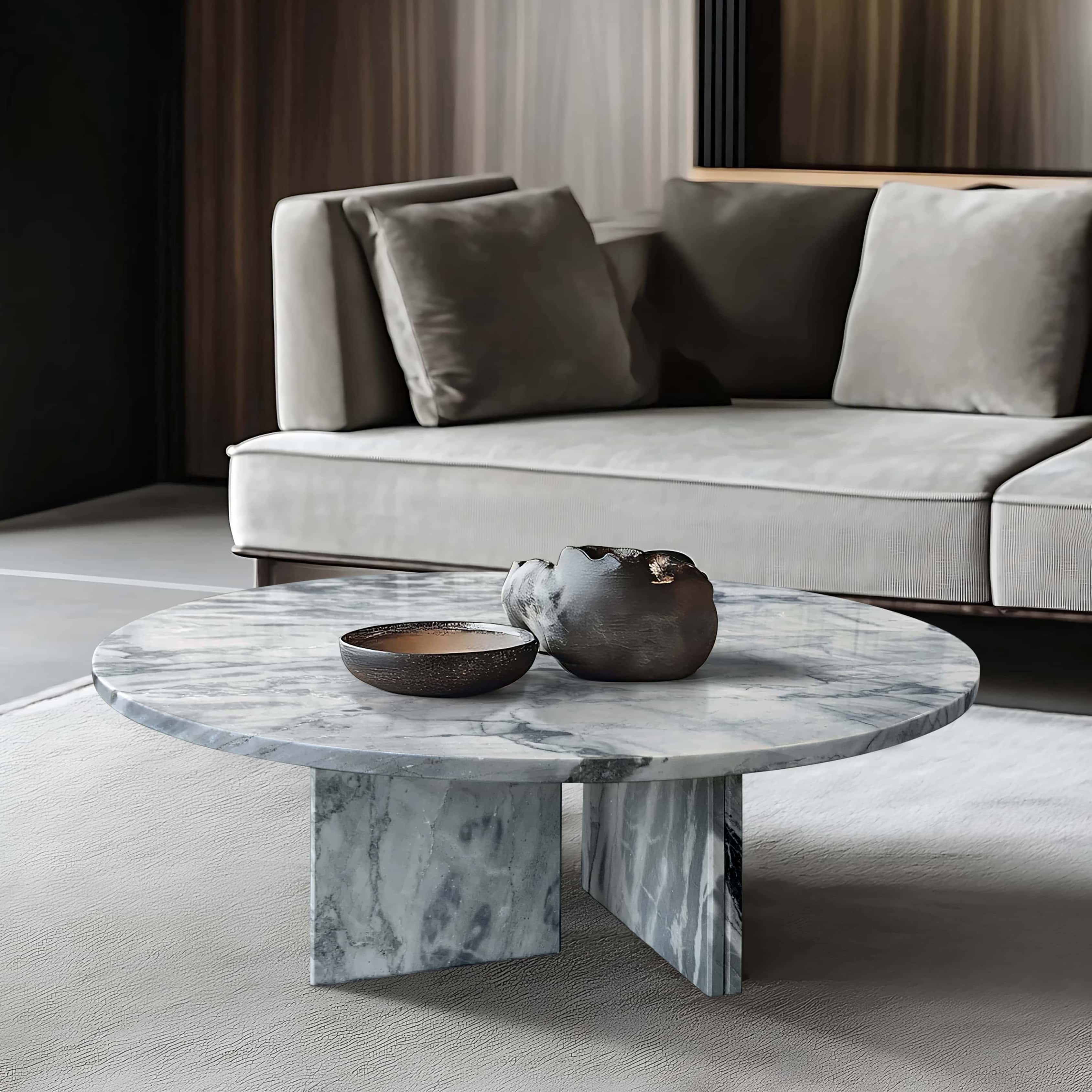 Cloudy blue marble coffee table in modern hotel lounge suite with taupe linen sofa, dark metal vessels, and walnut slatted accent wall.
