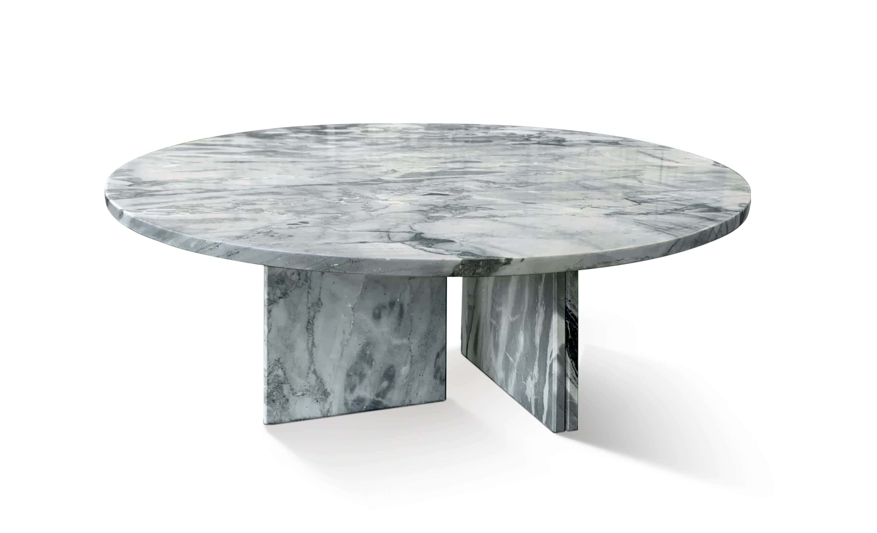 Cloudy blue marble round coffee table with polished surface, featuring soft white filament veining over a calm blue-gray base.