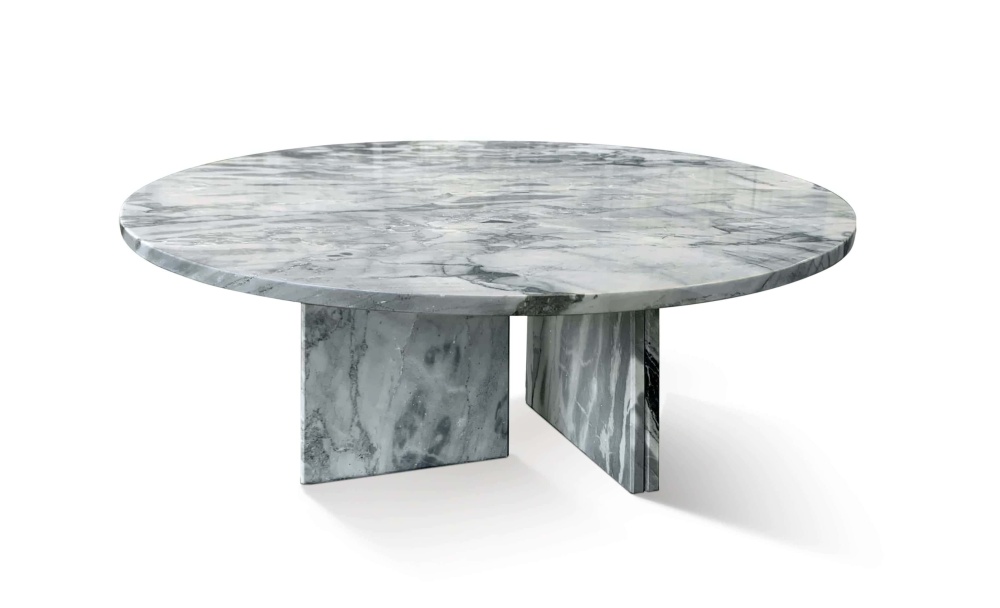 Cloudy blue marble round coffee table with polished surface, featuring soft white filament veining over a calm blue-gray base.