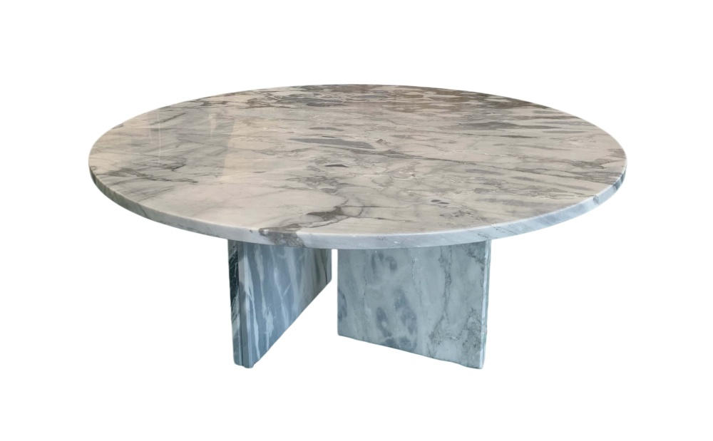 Cloudy blue natural marble coffee table with warm beige undertones and soft brown veining, polished round top with double-panel base.