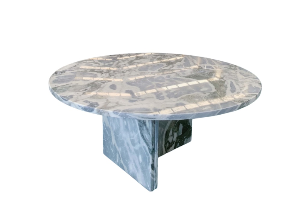 Round cloudy blue marble coffee table, polished surface displaying layered white cloud-like patches over deep blue-gray stone.