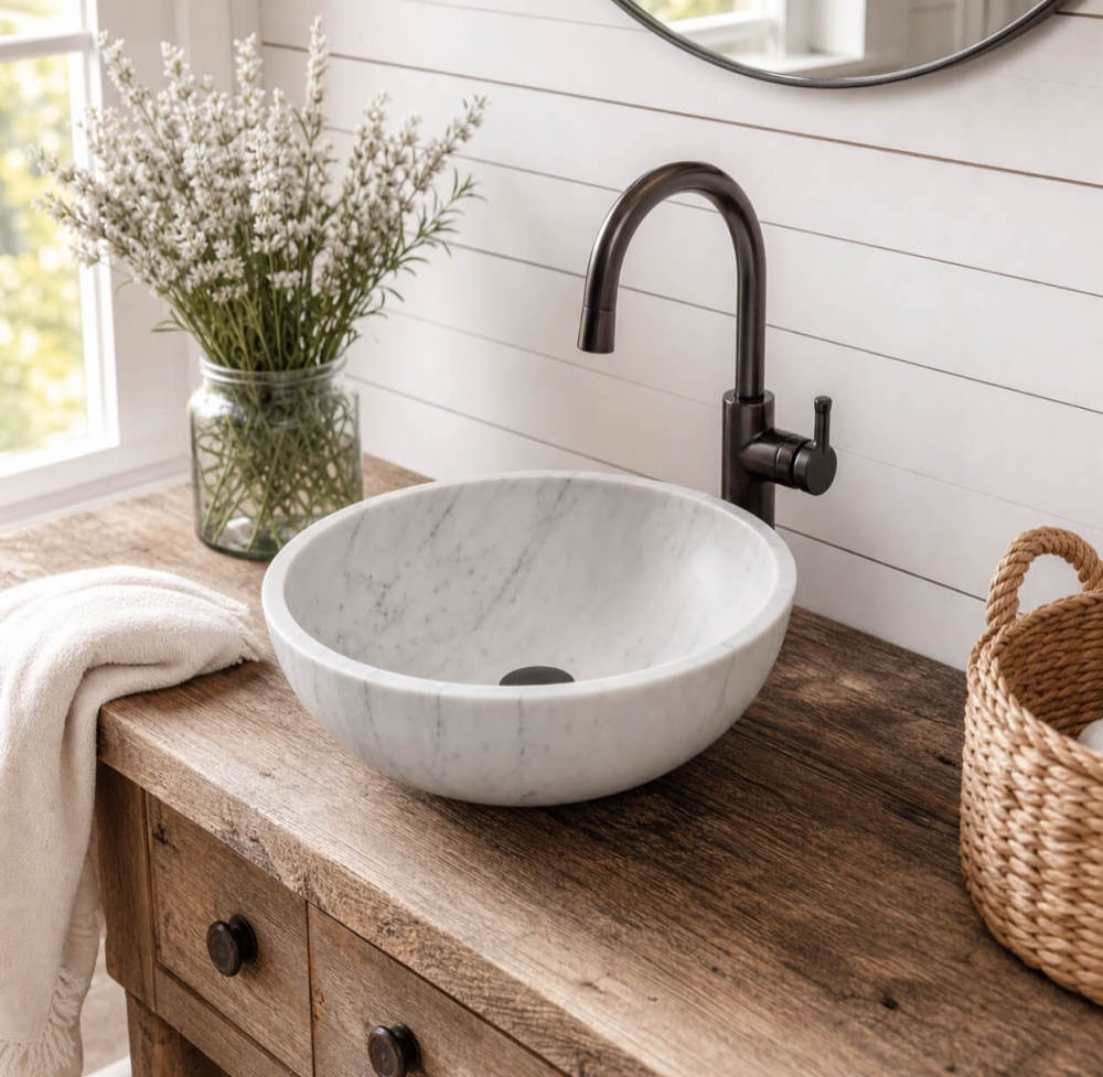 Snow Mountain white marble vessel sink on reclaimed wood vanity, shiplap wall, bronze faucet, modern farmhouse bathroom.